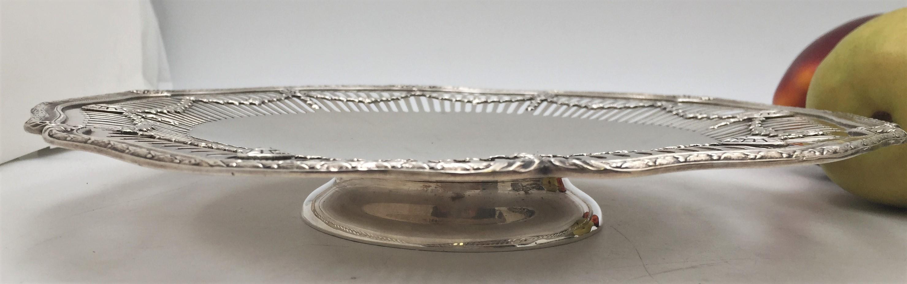 Shreve & Co.,early 20th century, sterling silver compote/ dish with beautiful pierced work, flowers, and medallions near the rim, possibly in Adam pattern. It measures 11 1/4'' in diameter by 1 3/4'' in height, weighs 17.2 troy ounces, and bears
