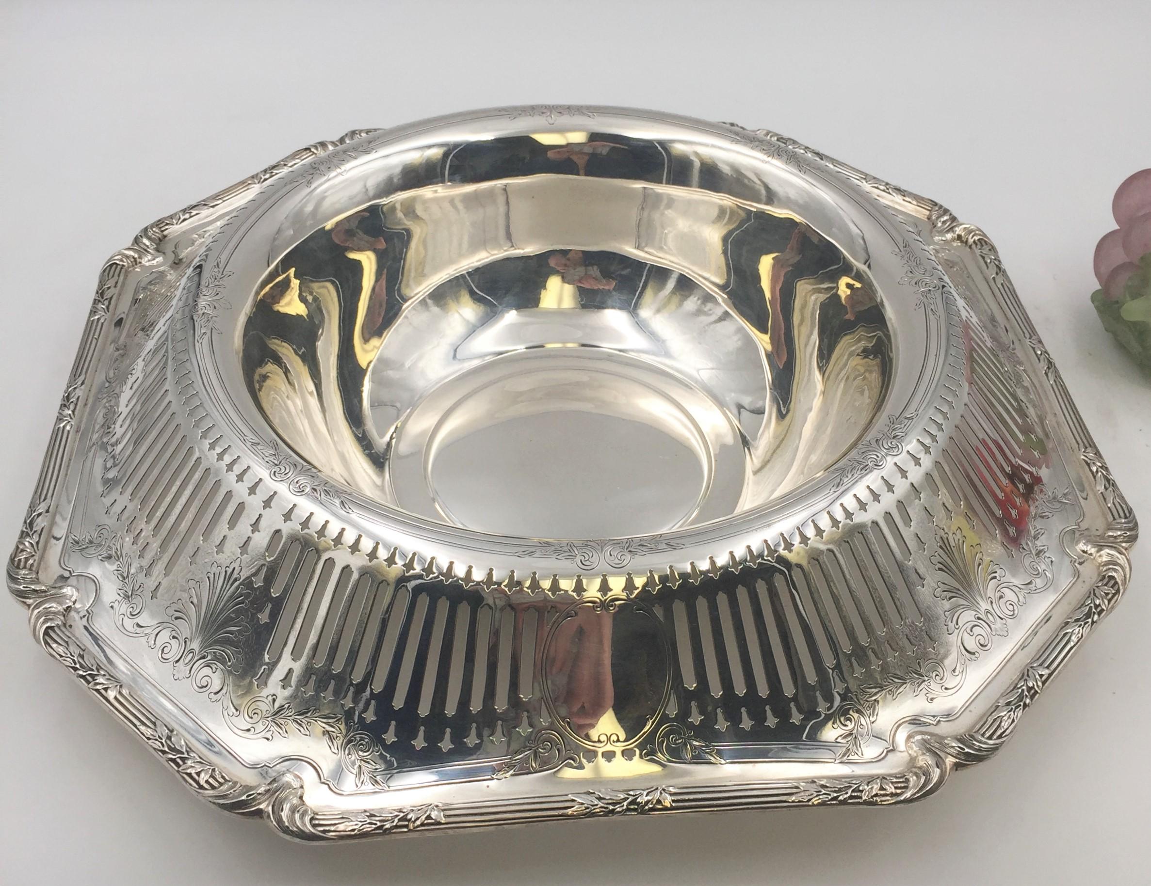 Beautiful Shreve & Co sterling silver large centerpiece bowl with a roll over lip pierced with Fleur-de-lis pattern. Perfect for the holidays and other special occasions! Measurements: Height: 7 inches, Width: 16 inches, Weight: 45 ozt. Bearing