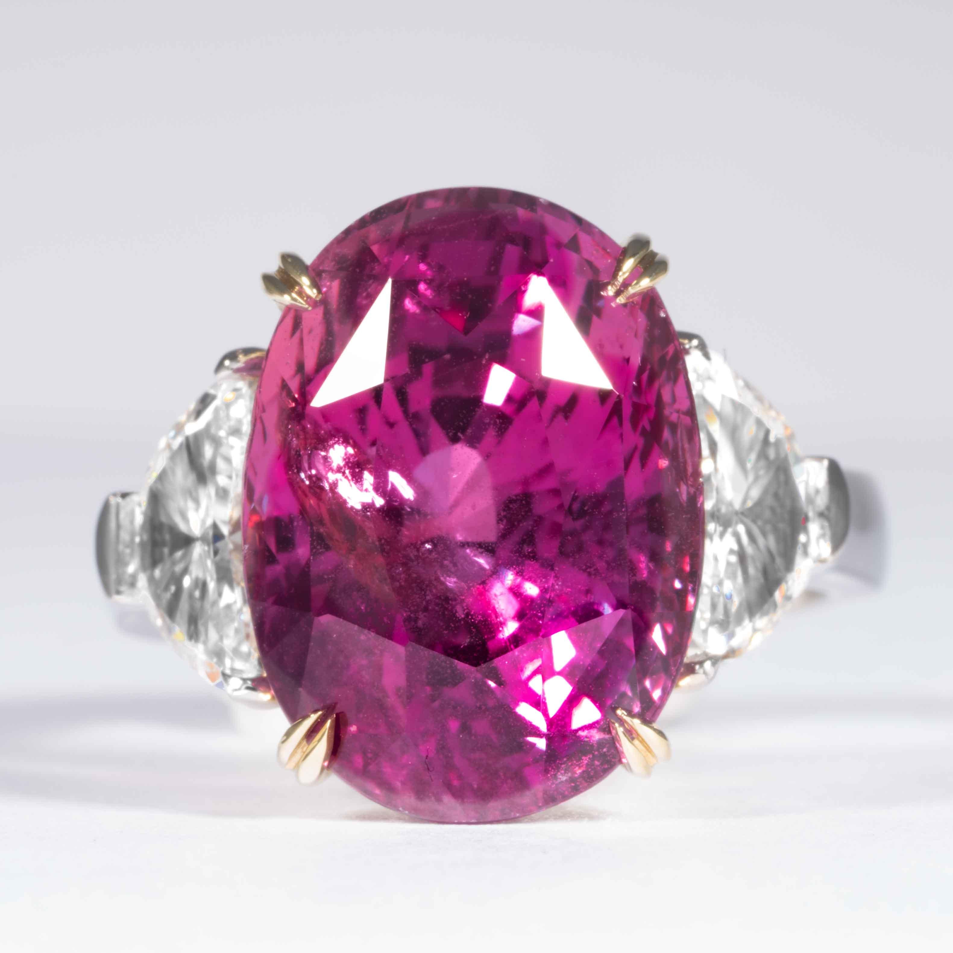 This sapphire and diamond 3-stone ring is offered by Shreve, Crump & Low.  This oval cut pink sapphire is custom set in a handcrafted Shreve, Crump & Low 3-stone platinum ring. This vibrant pink oval cut sapphire measures 16.14 x 11.73 x 10.51 mm