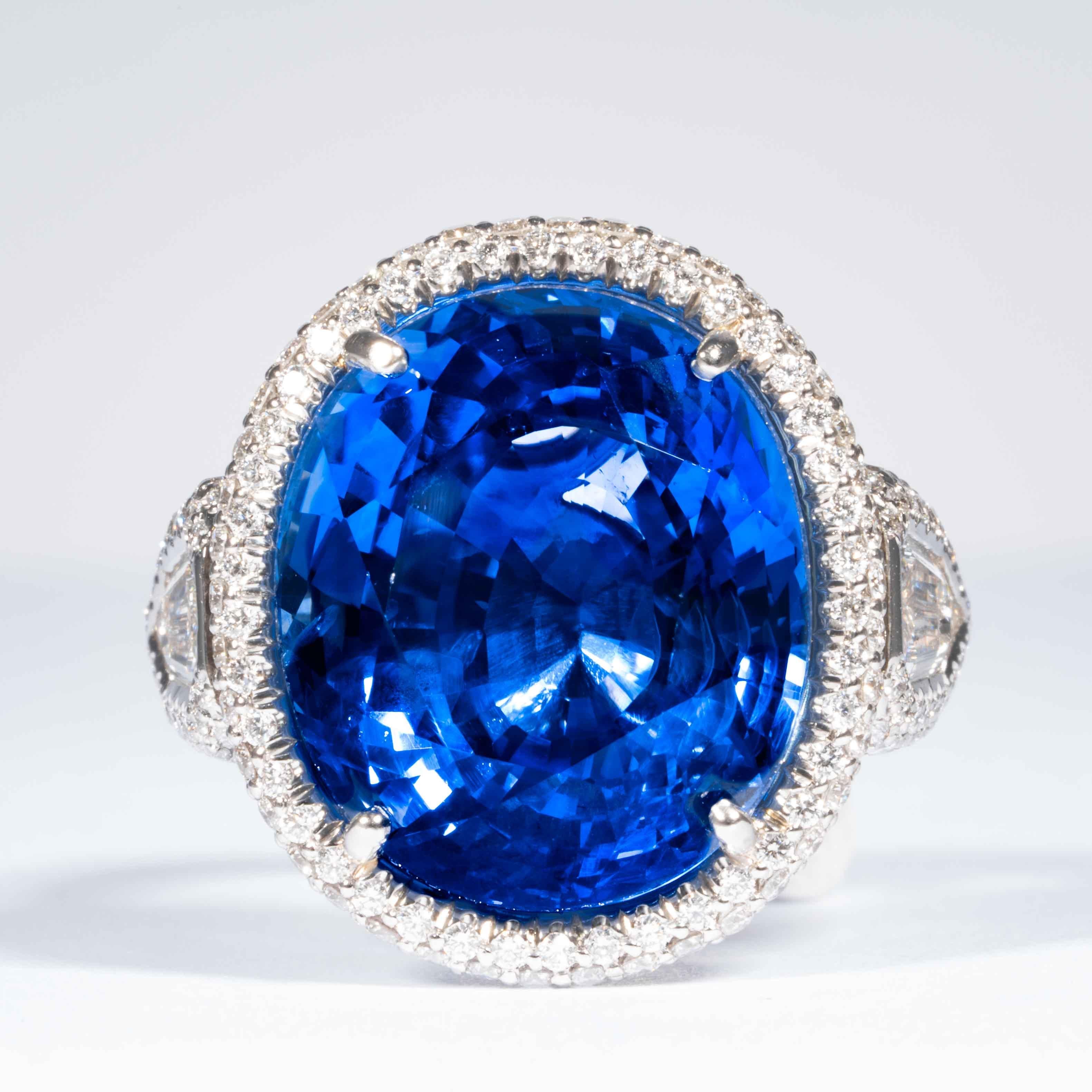 This sapphire and diamond cluster ring is offered by Shreve, Crump & Low.  This blue oval cut sapphire is custom set in a handcrafted Shreve, Crump & Low one-of-kind platinum cluster ring, consisting of 1 majestic cornflower blue oval cut sapphire