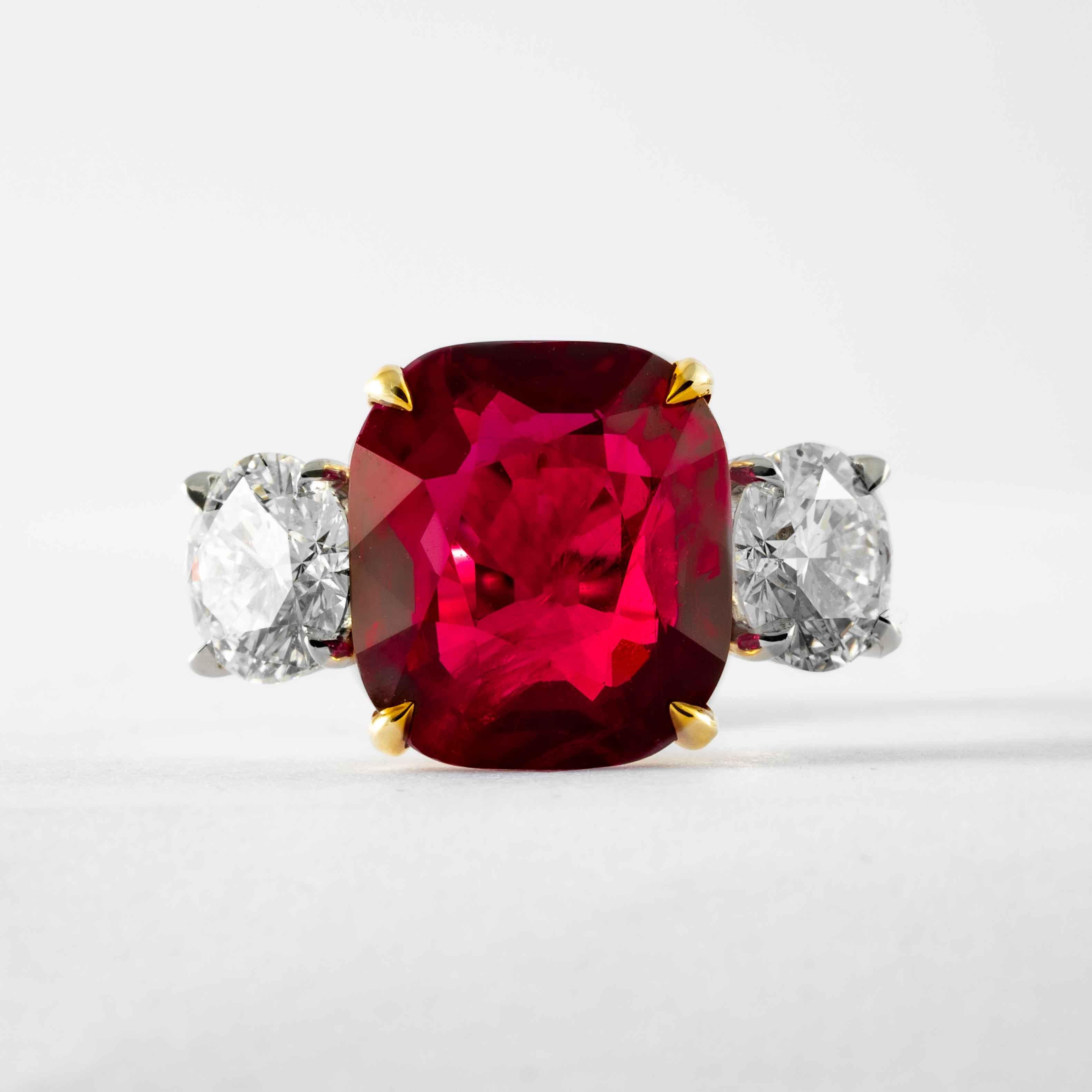 This ruby and diamond 3-stone ring is offered by Shreve, Crump & Low. This cushion cut ruby is custom set in a handcrafted Shreve, Crump & Low classic 3-stone platinum and 18kt yellow gold ring, consisting of 1 extraordinarily saturated red cushion