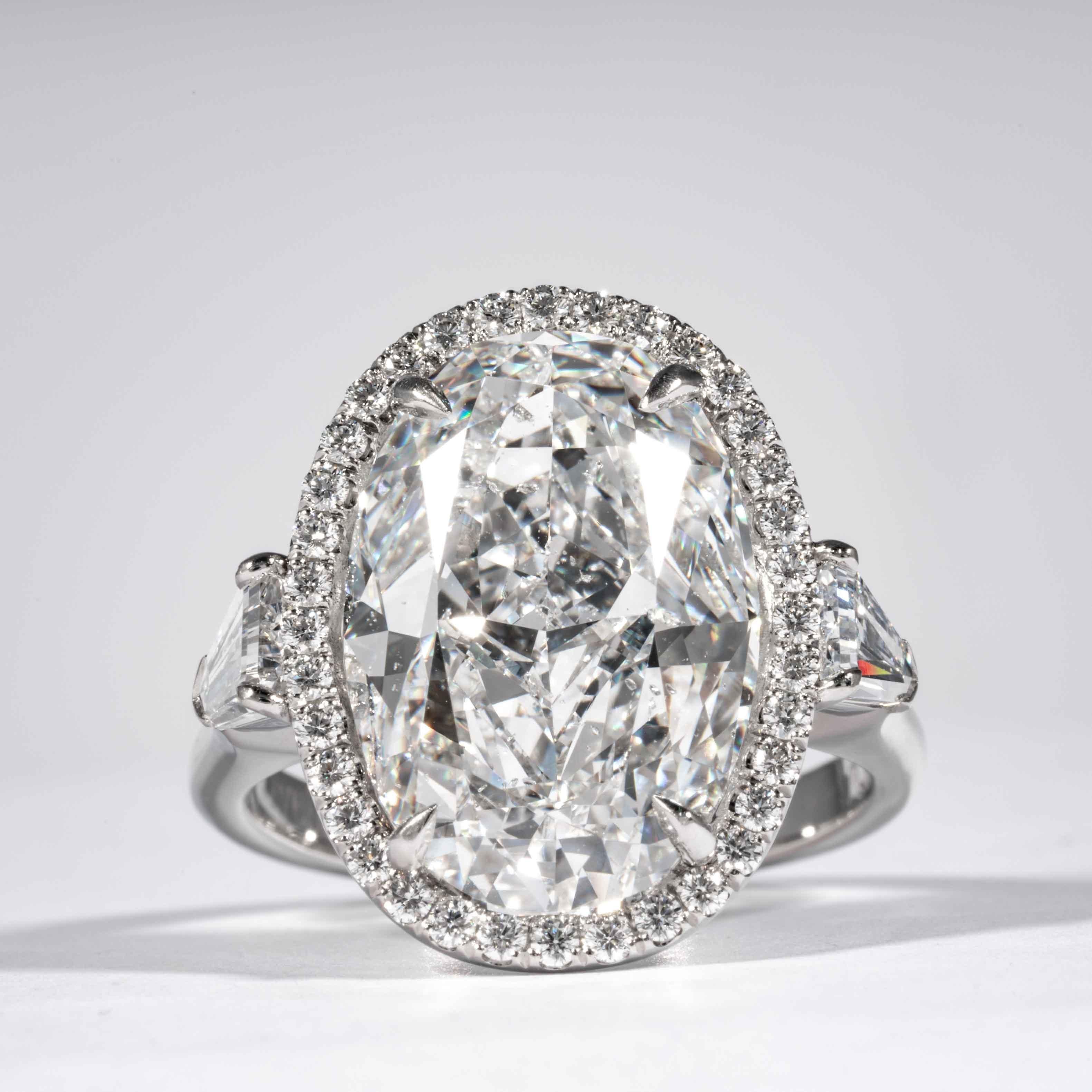 This oval cut diamond ring is offered by Shreve, Crump & Low. This 10.14 carat GIA Certified D SI2 oval cut diamond measuring 17.23 x 11.68 x 7.06 mm is custom set in a handcrafted Shreve, Crump & Low platinum 3-stone ring. The 10.14 carat oval cut