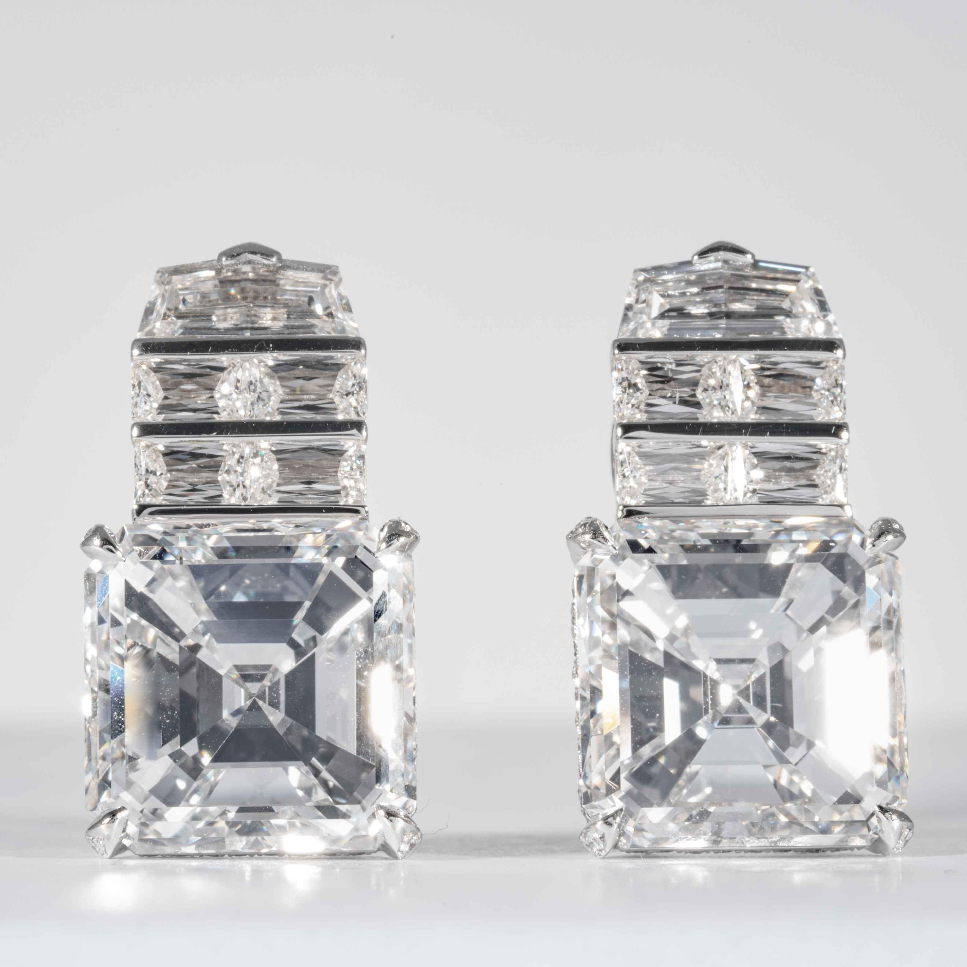 These earrings are offered by Shreve, Crump & Low. These exceptional diamond drop earrings incorporate two GIA certified asscher cut diamonds, one weighing 9.19 carats with a color and clarity of F VVS1 (GIA report no. 5191337302), the other weighs