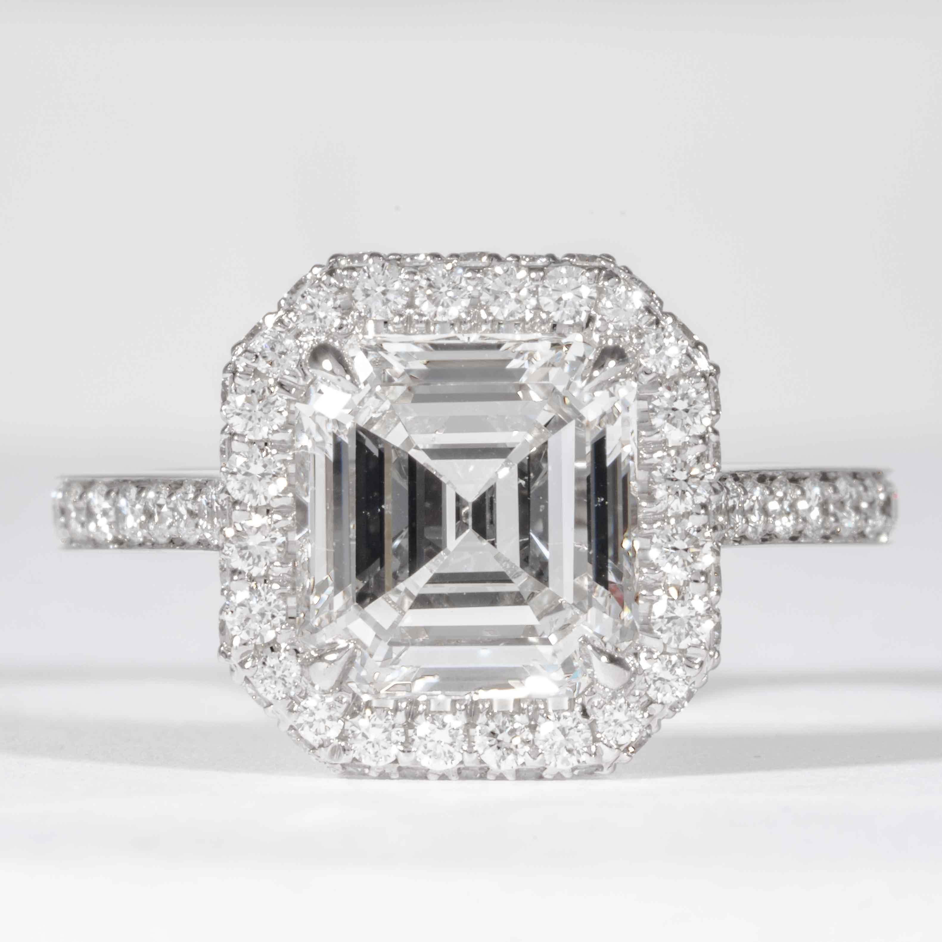 This diamond ring is offered by Shreve, Crump & Low. This 2.74 carat GIA certified E SI1 emerald cut diamond is custom set in a handcrafted Shreve, Crump & Low platinum diamond halo ring. The 2.74 carat Emerald cut is surrounded by 88 round diamonds