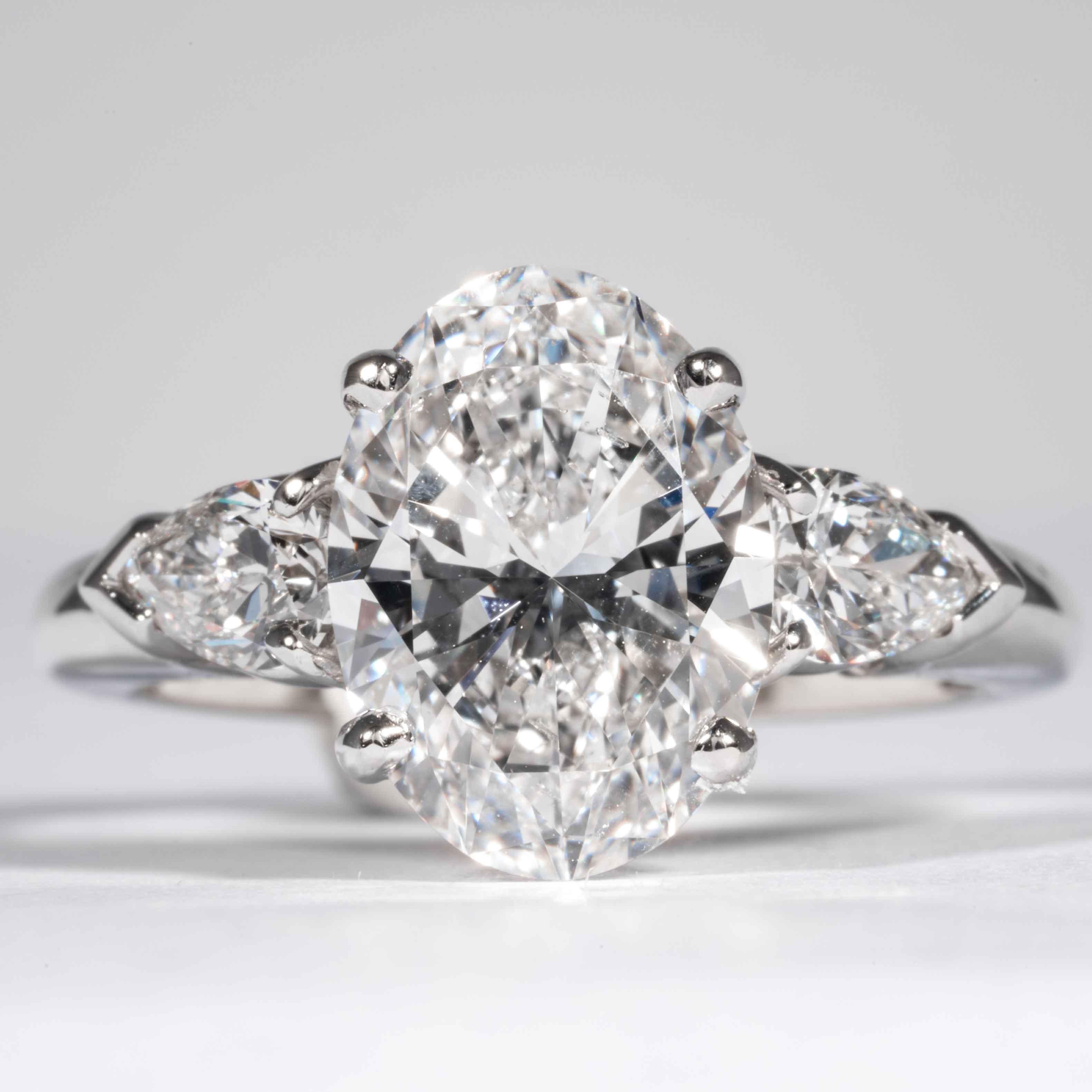 This classic oval cut diamond ring is offered by Shreve, Crump & Low. This 3.20 carat GIA Certified D SI1 Oval cut diamond measuring 11.71 x 8.47 x 5.14 mm is custom set in a handcrafted Shreve, Crump & Low classic platinum 3-stone ring. The 3.20