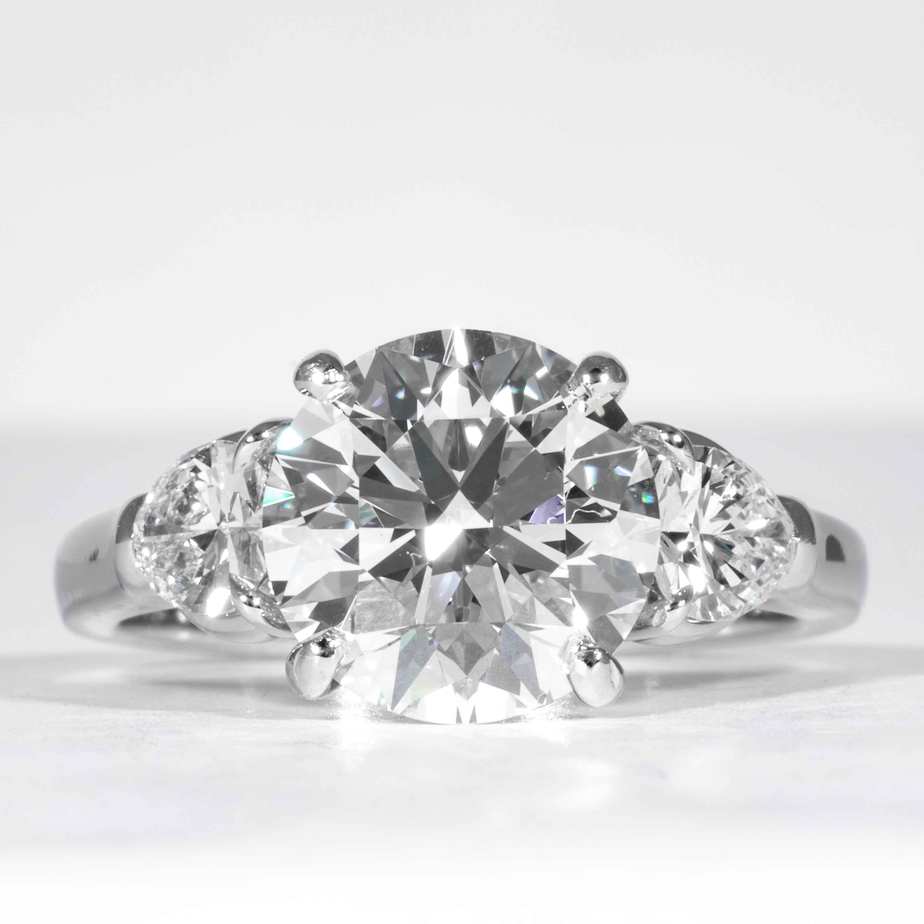 This elegant and classic diamond ring is offered by Shreve, Crump & Low. This 3.23 carat GIA Certified E VVS2 round brillinat cut diamond measuring 9.42 - 9.46 x 5.88 mm is custom set in a handcrafted Shreve, Crump & Low platinum 3-stone ring. The