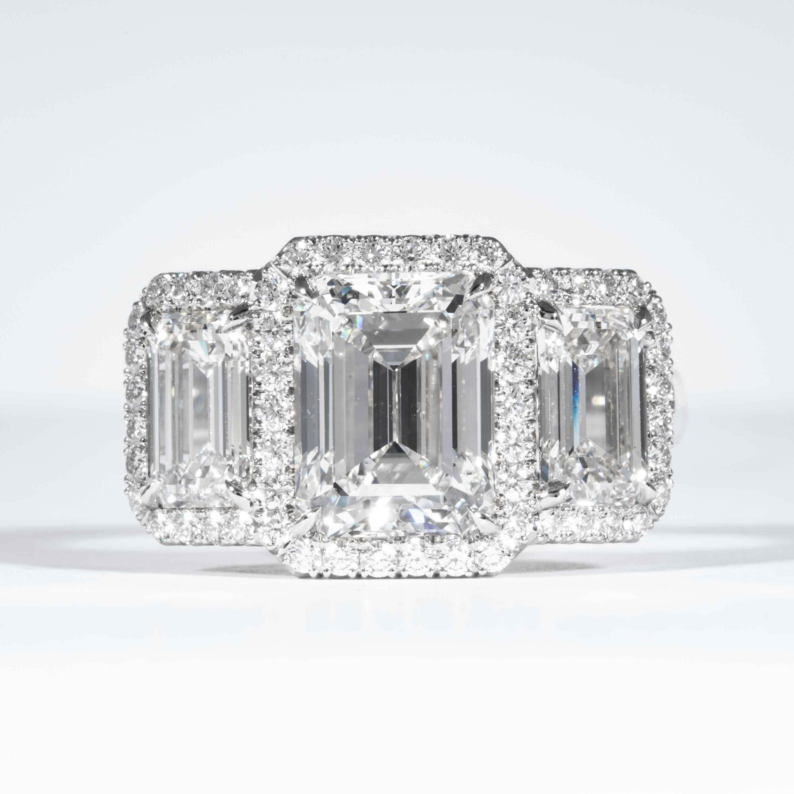 This 3-Stone diamond ring is offered by Shreve, Crump & Low. This 3.23 carat GIA Certified G SI1 emerald cut diamond measuring 9.52 x 7.28 x 5.05 mm is custom set in a handcrafted Shreve, Crump & Low platinum 3-stone ring. The 3.23 carat emerald cut