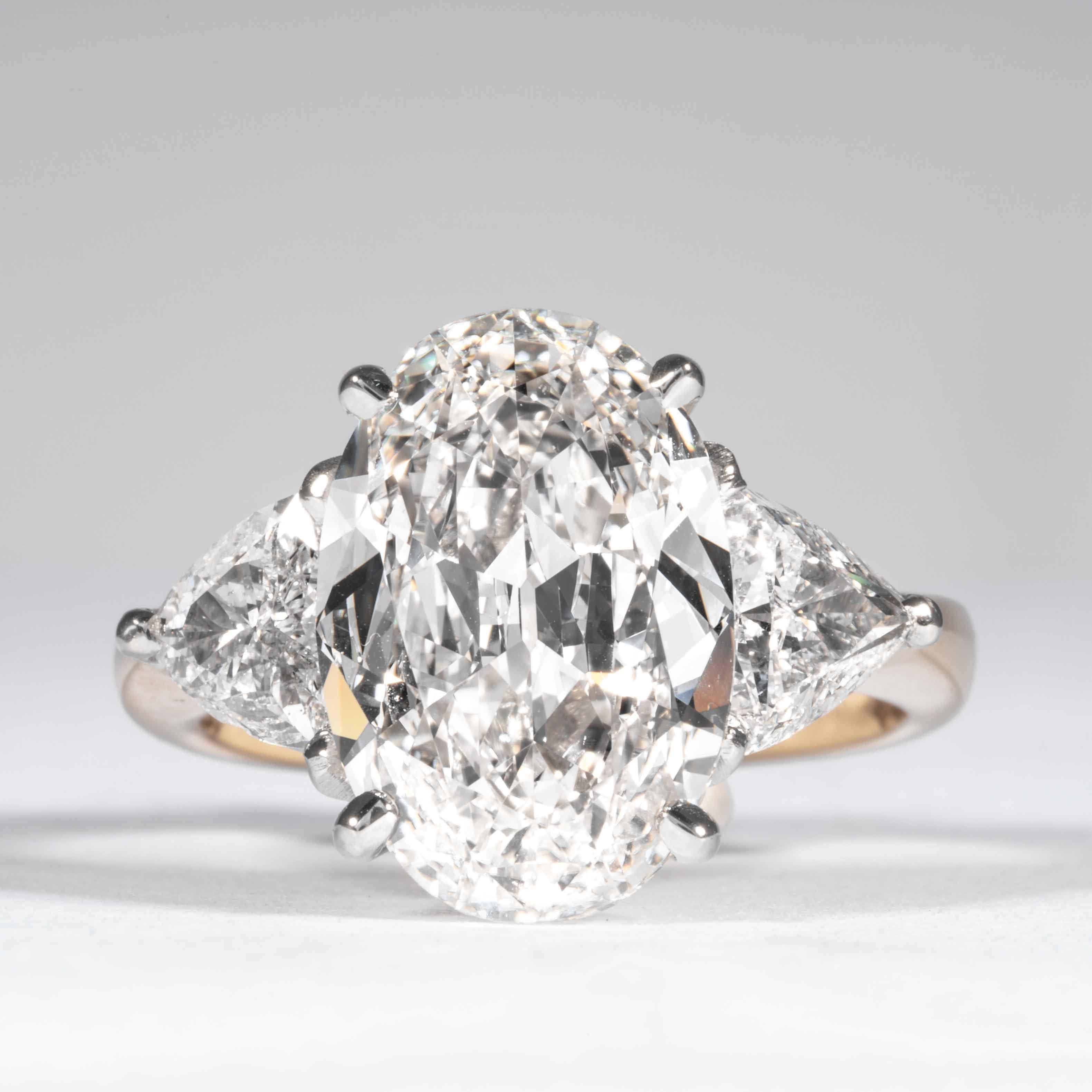This classic oval cut diamond ring is offered by Shreve, Crump & Low. This 5.03 carat GIA Certified H VS1 Oval cut diamond measuring 14.15 x 9.62 x 4.83mm is custom set in a handcrafted Shreve, Crump & Low classic platinum and 18k yellow gold