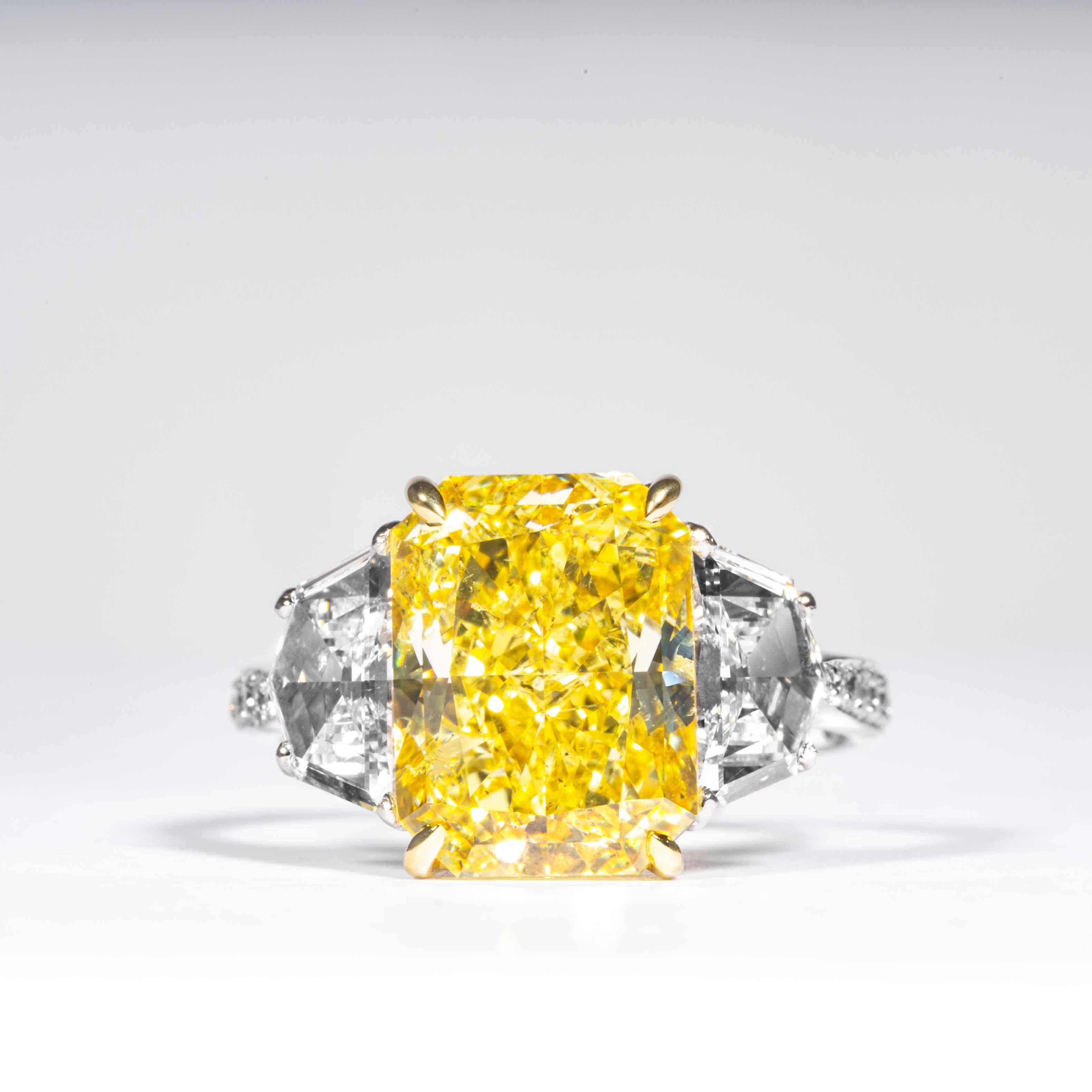 This fancy intense yellow radiant cut diamond is offered by Shreve, Crump & Low.  This fancy intense yellow radiant diamond measuring 11.13 x 8.34 x 6.01 mm is custom set in a handcrafted Shreve, Crump & Low platinum and 18 karat yellow gold 3 stone