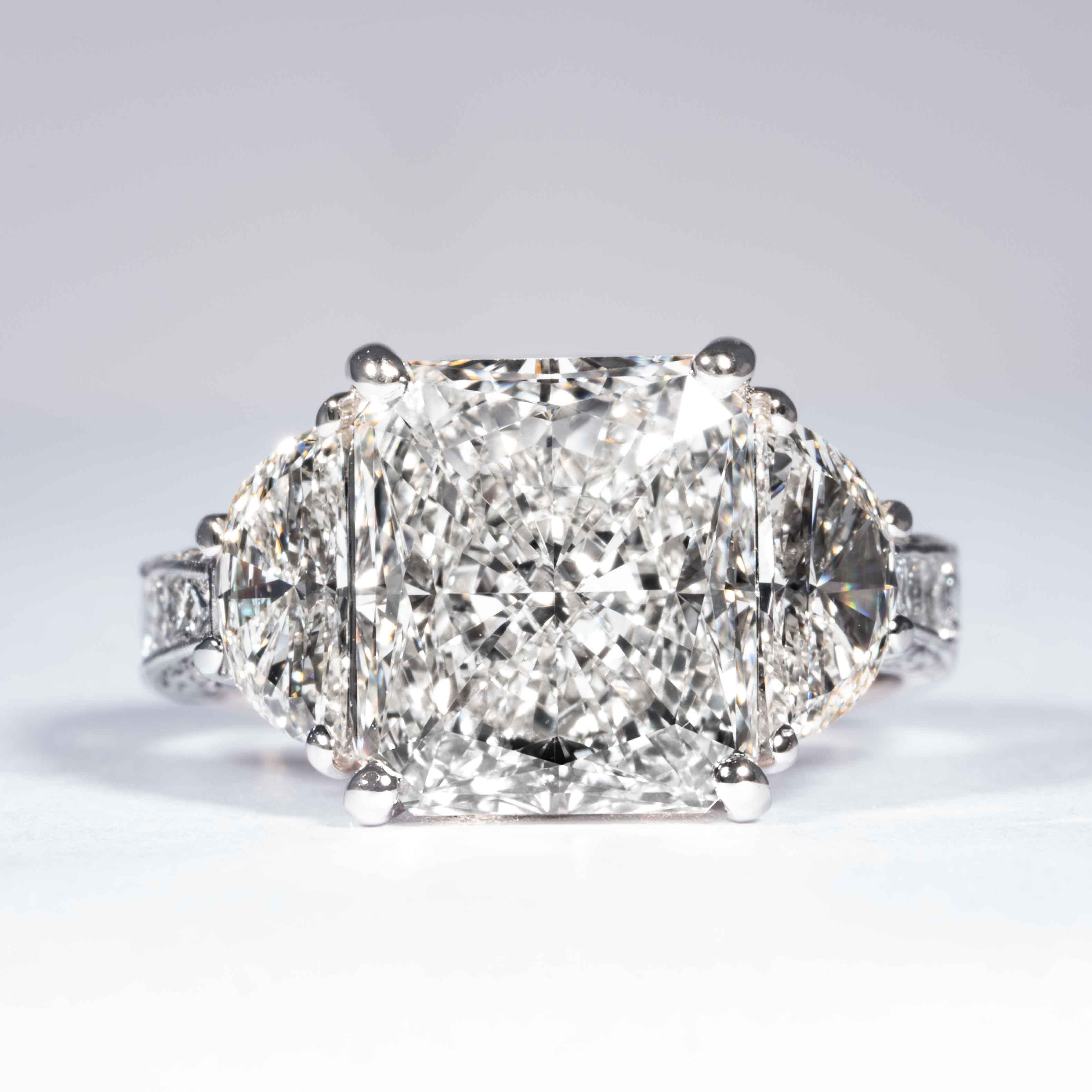 This radiant cut diamond ring is offered by Shreve, Crump & Low. This 5.07 carat GIA Certified I VS2 radiant cut diamond measuring 11.06 x 9.62 x 5.67 mm is custom set in a handcrafted Shreve, Crump & Low platinum 3-stone ring. The 5.07 carat
