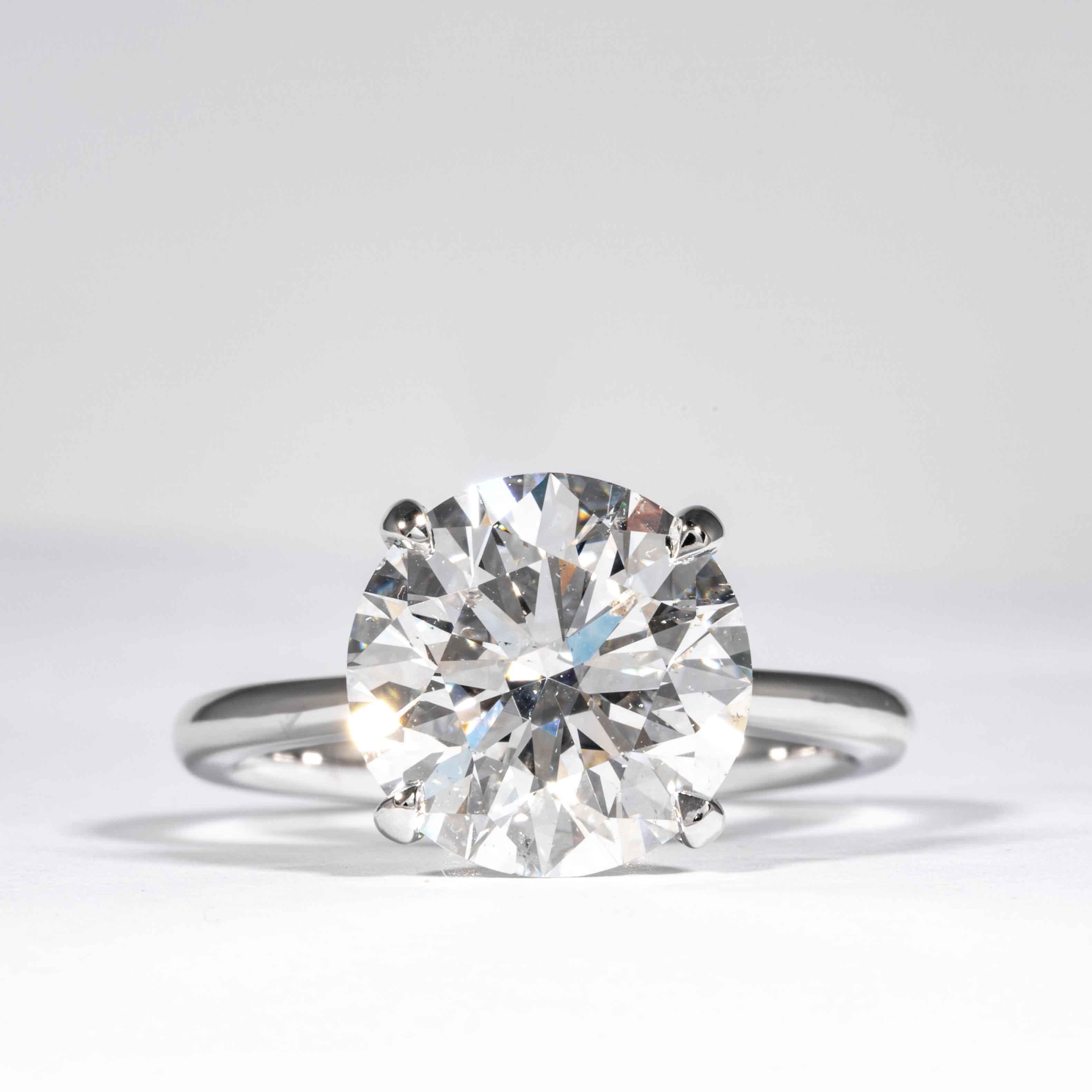 This elegant and classic diamond ring is offered by Shreve, Crump & Low. This 5.12 carat GIA certified E SI1 round brilliant cut diamond measuring 11.05 x 11.08 x 6.84 mm is custom set in a handcrafted Shreve, Crump & Low 18 karat white gold 4-prong