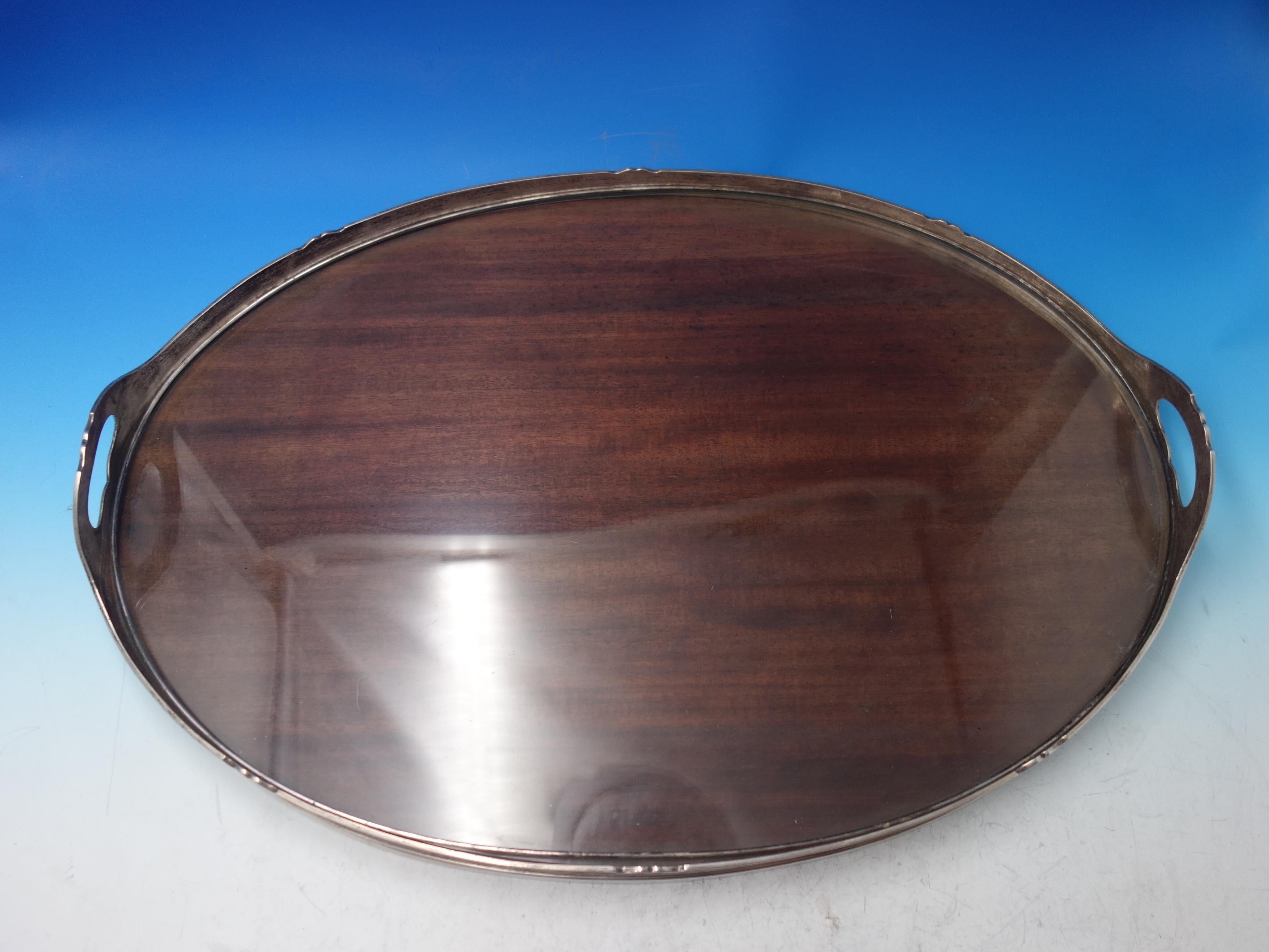 San Lorenzo by Tiffany and Co

Shreve sterling frame gallery tray with wooden center and glass top, measuring 24