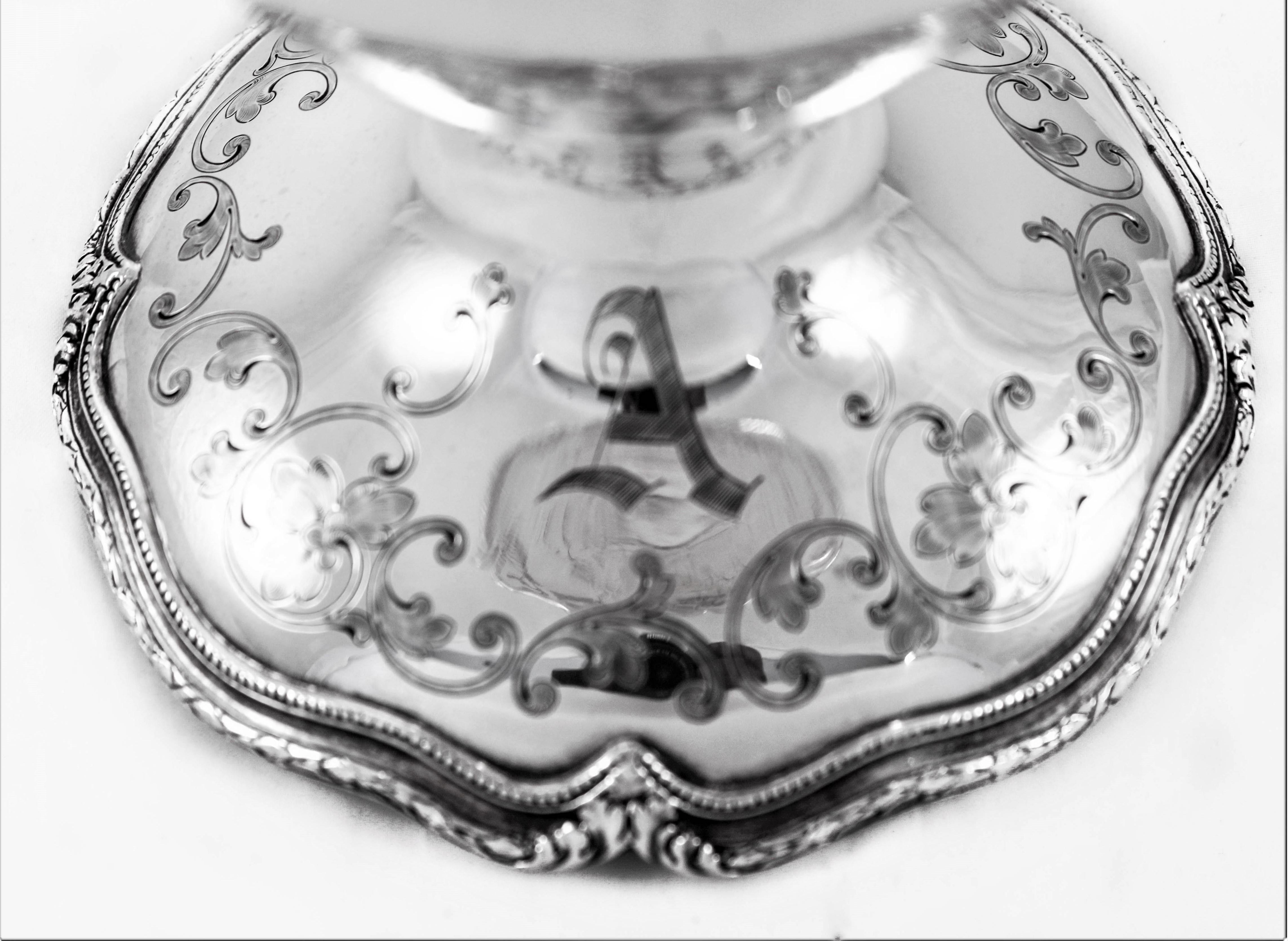 This rose bowl by Shreve & Company is a wonderful example of Victorian style silver. Decorated with etched flowers, leaves and swirls along the rim, body and base. The base and rim have a scalloped edge with the same matching pattern. Unlike most