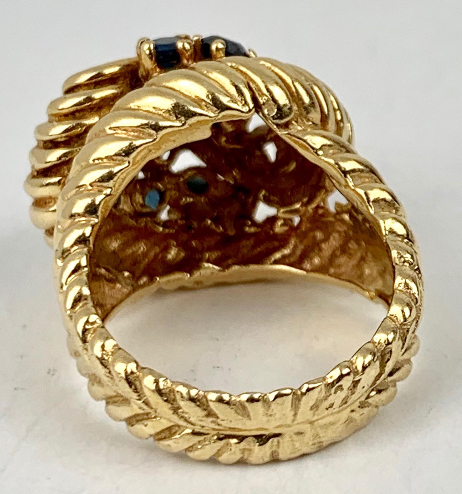 Contemporary  Shrimp Style Gold Ring with 10 Round Faceted Sapphires, 14 kt y.g. For Sale