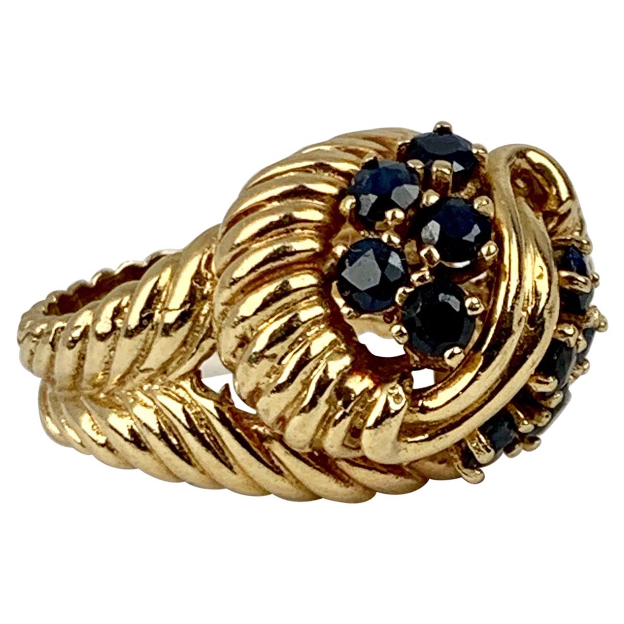  Shrimp Style Gold Ring with 10 Round Faceted Sapphires, 14 kt y.g. For Sale