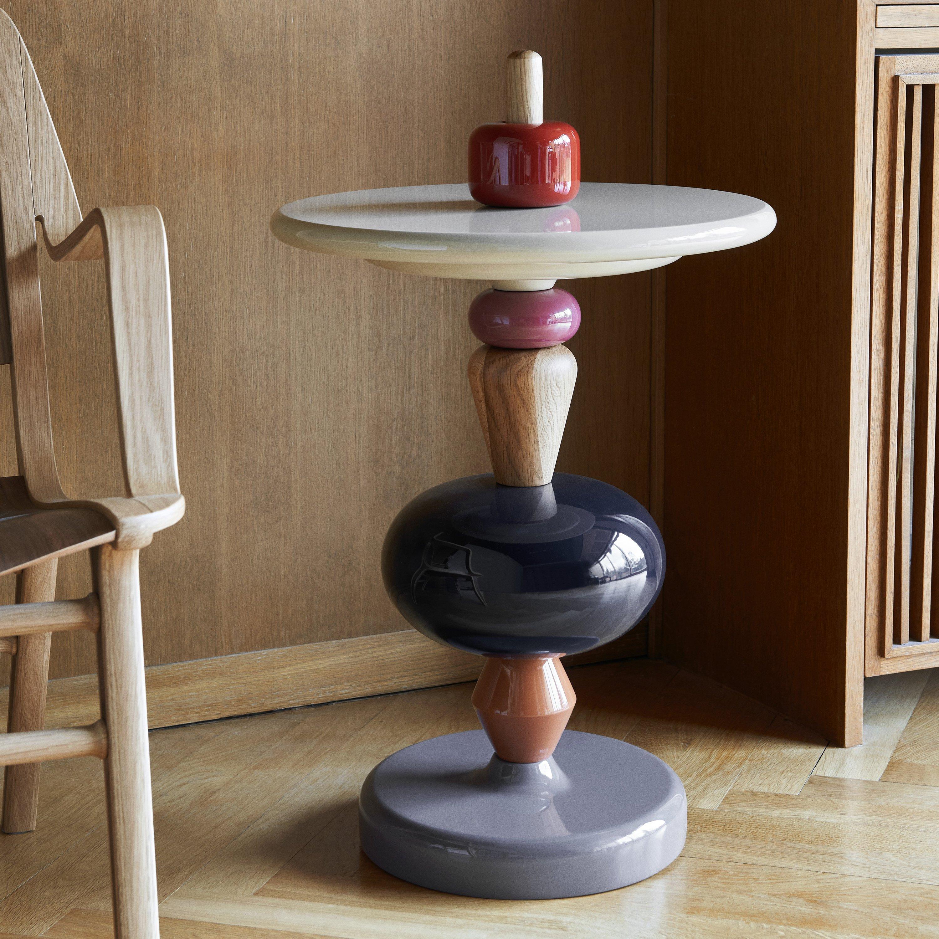 The shuffle side table in array colors seems to conjure images of classic wooden toys and with good reason. 
The choice of colors and the fact that you can unify and construct the table as you like are all ideas Mia Hamborg got from the Brio