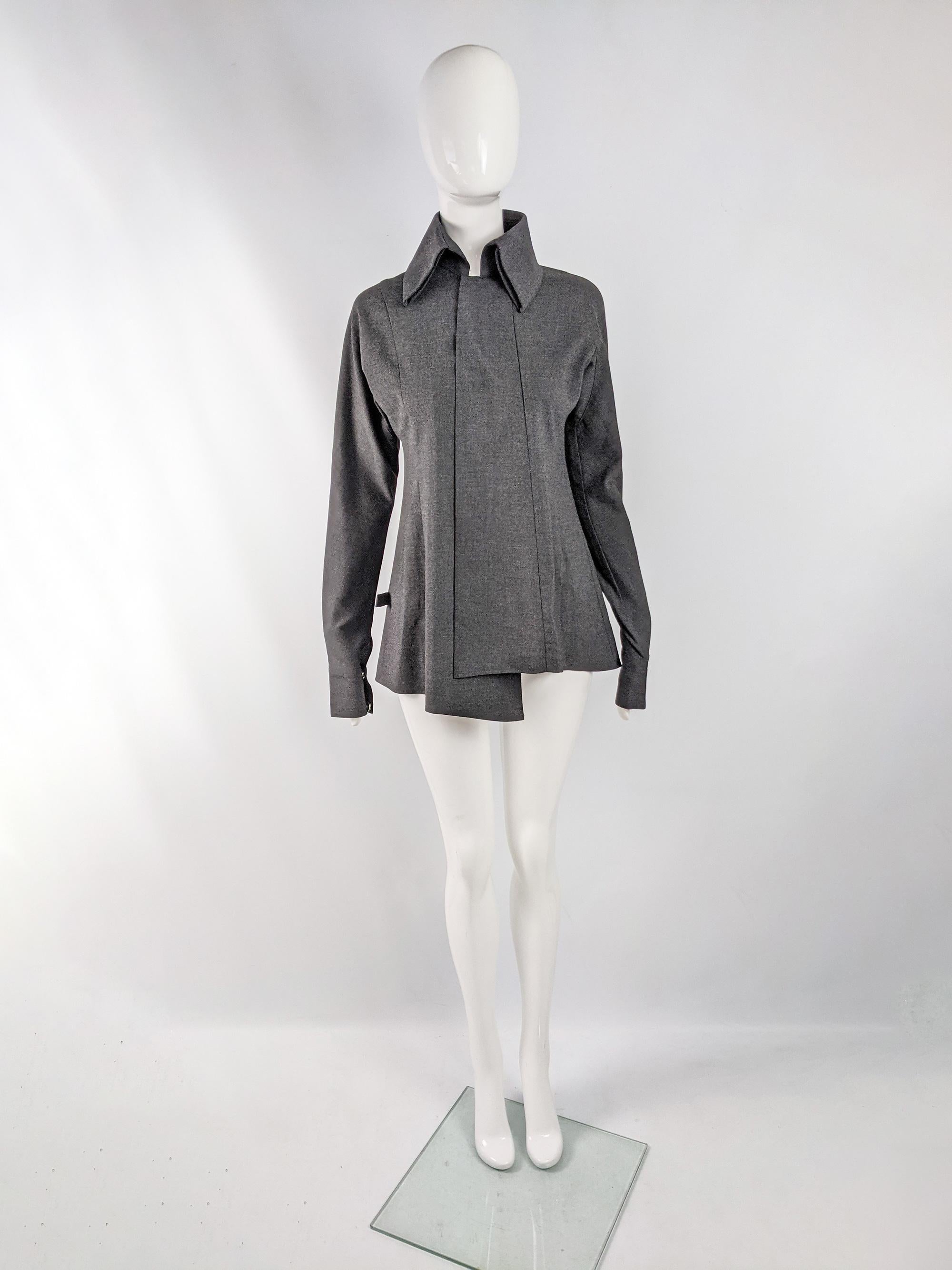 An amazing and rare vintage womens shirt / lightweight jacket from 1998 by cult Japanese designer, Shuhei Ogawa. Made in Japan from a charcoal grey fabric, it has popper buttons down the front which gives a clean, minimalist look. The cut is very