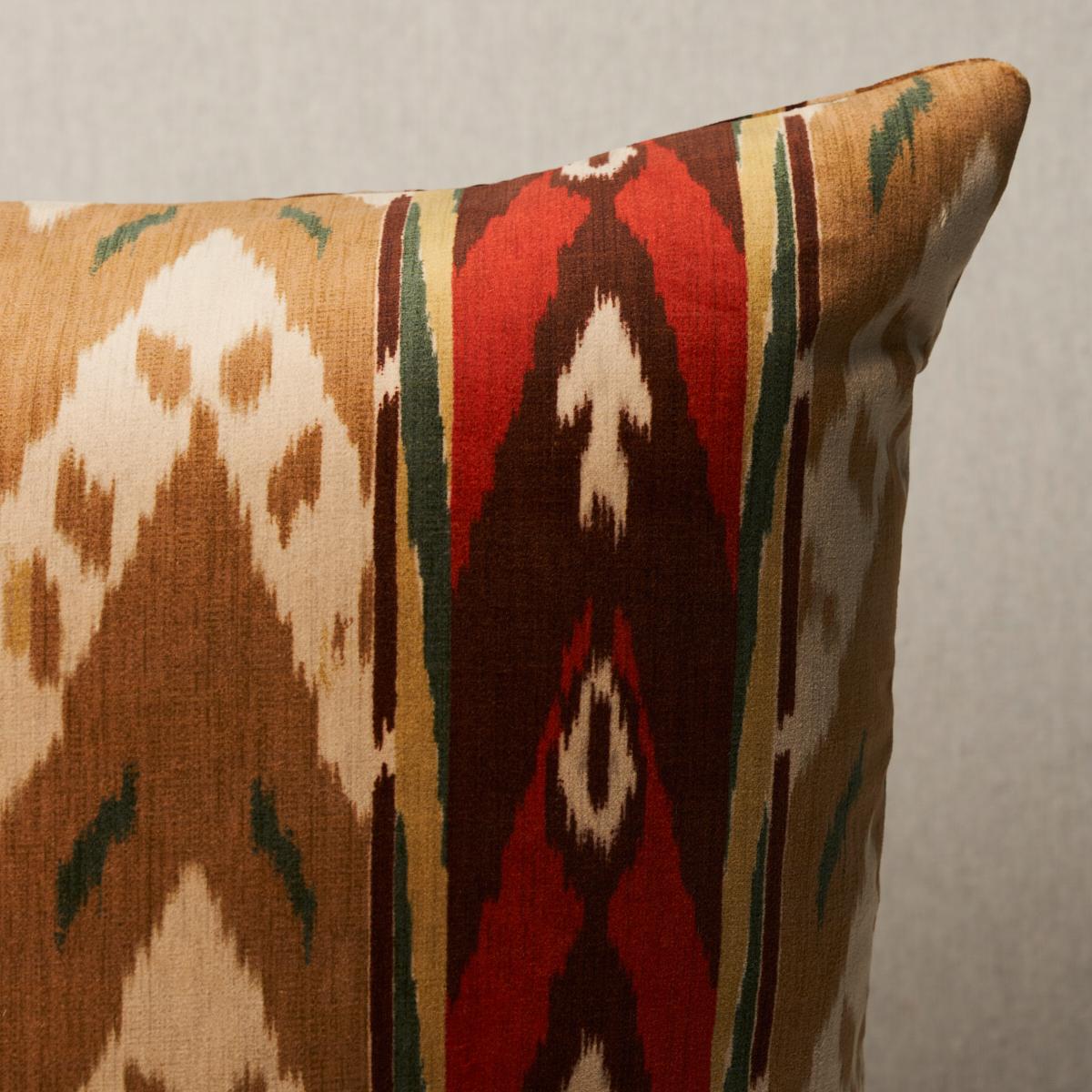 This pillow features Samar Ikat Velvet with a knife edge finish. Based on an antique woven silk, this lush cotton velvet was reinterpreted as a stripe and printed, allowing for a larger range of color and scale. Pillow includes a feather/down fill
