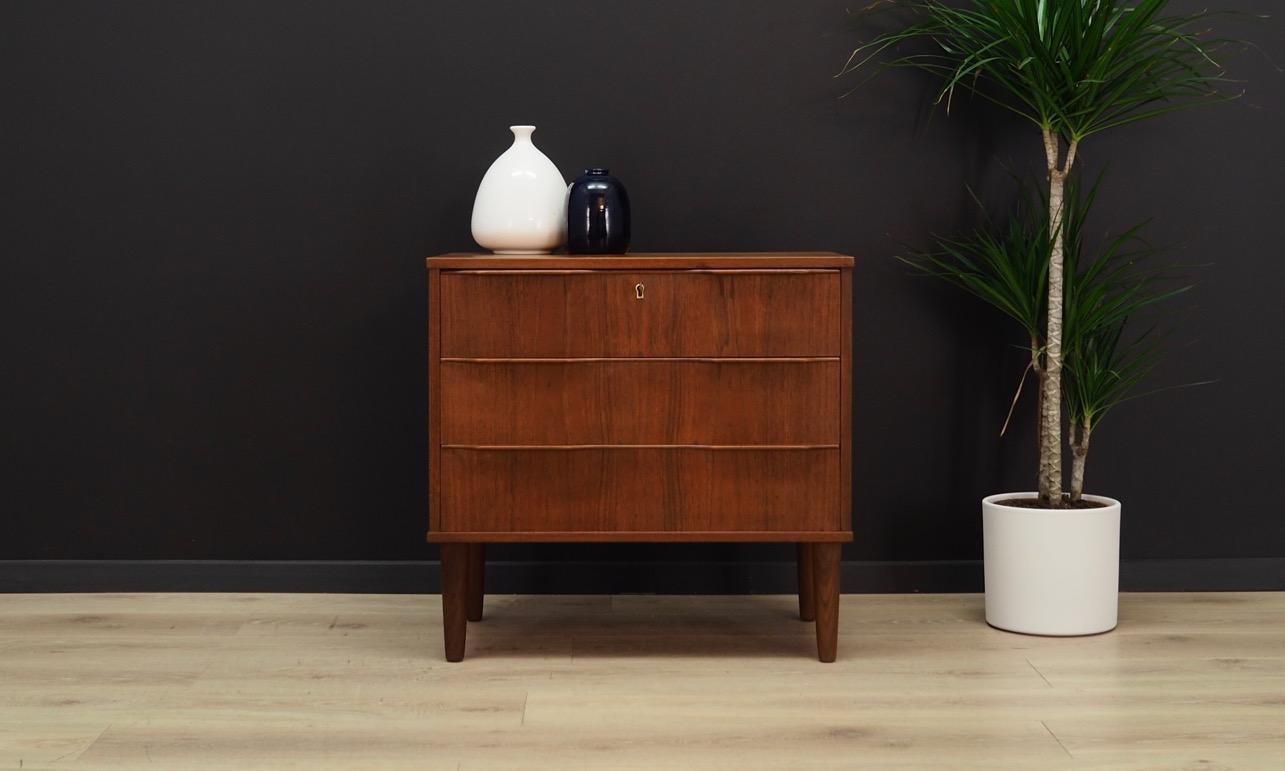 Exceptional chest of drawers from the 1960s-1970s. Danish design, Minimalist form. Manufactured in SI-BOMI factory. Surface of the furniture finished with teak veneer. Furniture with three drawers, key included. Maintained in good condition (minor