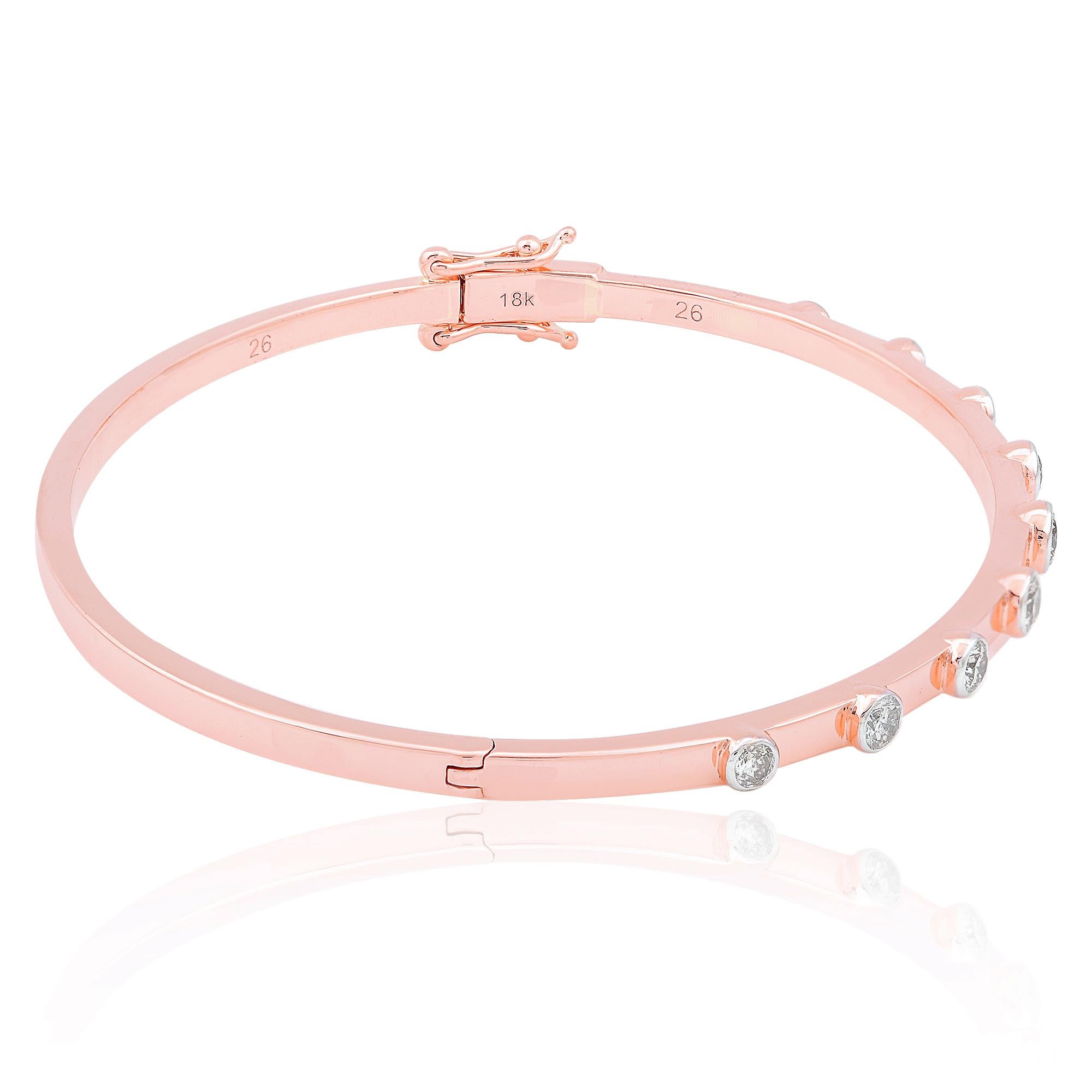 Immerse yourself in the enchanting beauty of this exquisite SI Clarity HI Color Round Diamond Bangle Bracelet, meticulously crafted in luxurious 18 Karat Rose Gold. A testament to refined elegance and timeless sophistication, this bracelet is sure