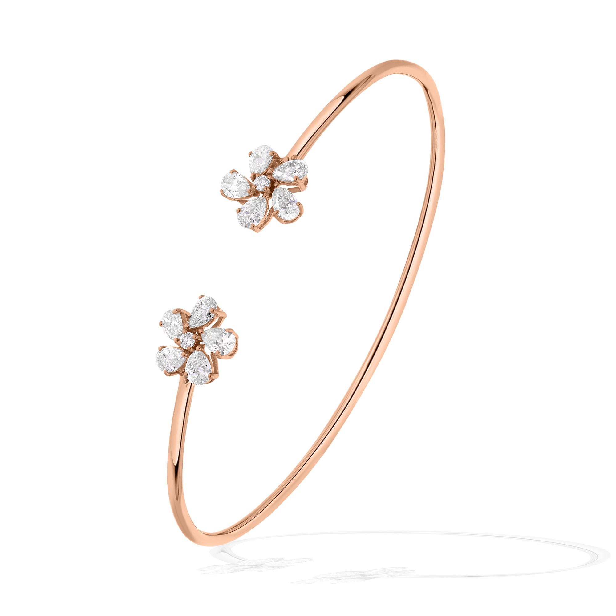 This exquisite cuff bangle bracelet features a dazzling centerpiece: a meticulously crafted round diamond flower set in 18 karat rose gold. The brilliance of the diamond is enhanced by its impressive clarity, graded SI (Slightly Included), ensuring