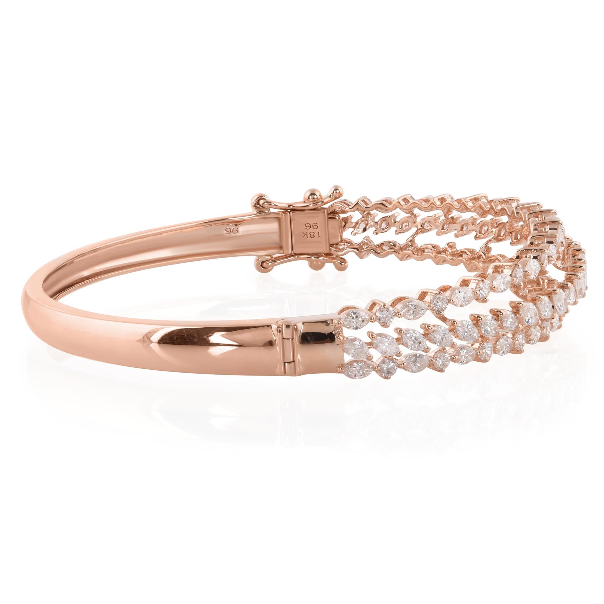 Elevate your style with the exquisite beauty of this stunning bangle bracelet, meticulously crafted from 14 karat rose gold and adorned with shimmering diamonds. With a captivating blend of round and marquise-cut diamonds, this bracelet is a true