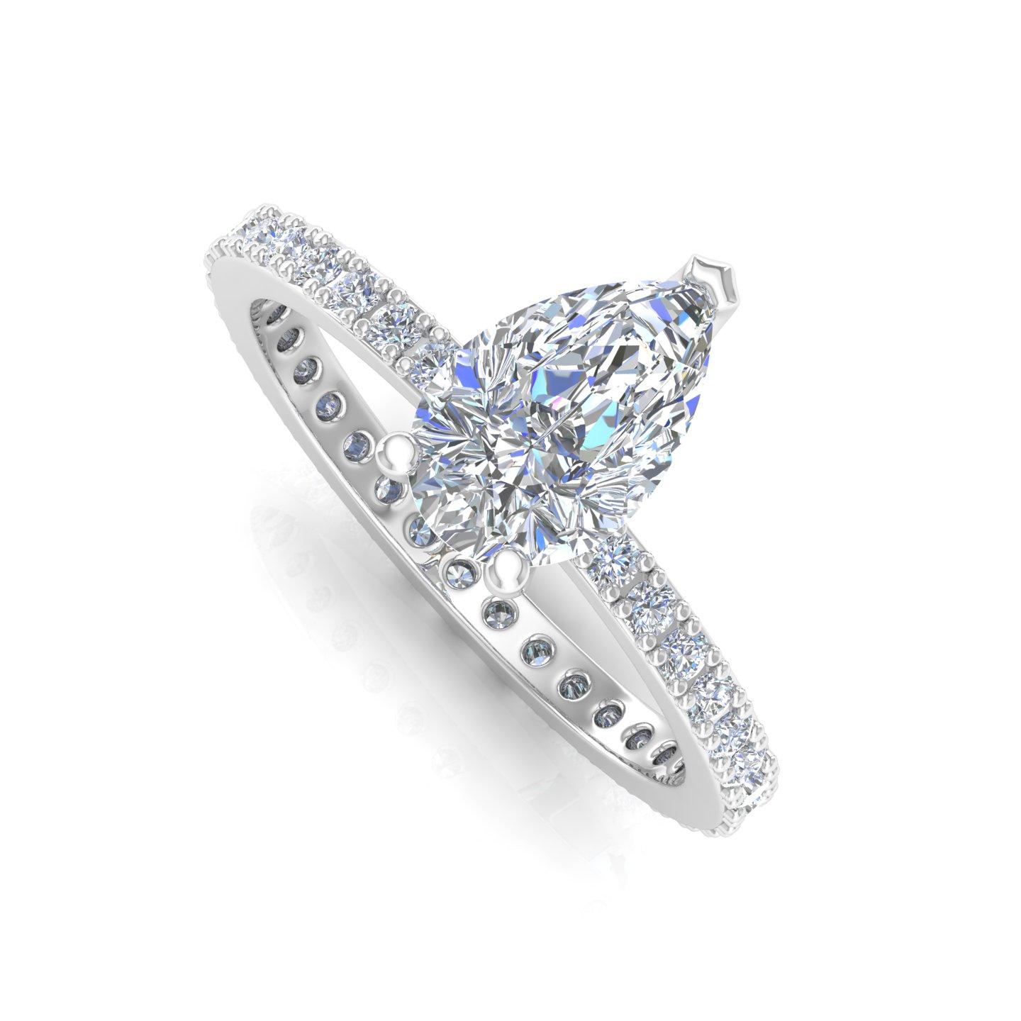 At the heart of this captivating piece rests a dazzling pear-cut diamond, renowned for its unique and graceful silhouette. The diamond boasts impeccable clarity, revealing the mesmerizing brilliance of each facet. Its pristine sparkle is further