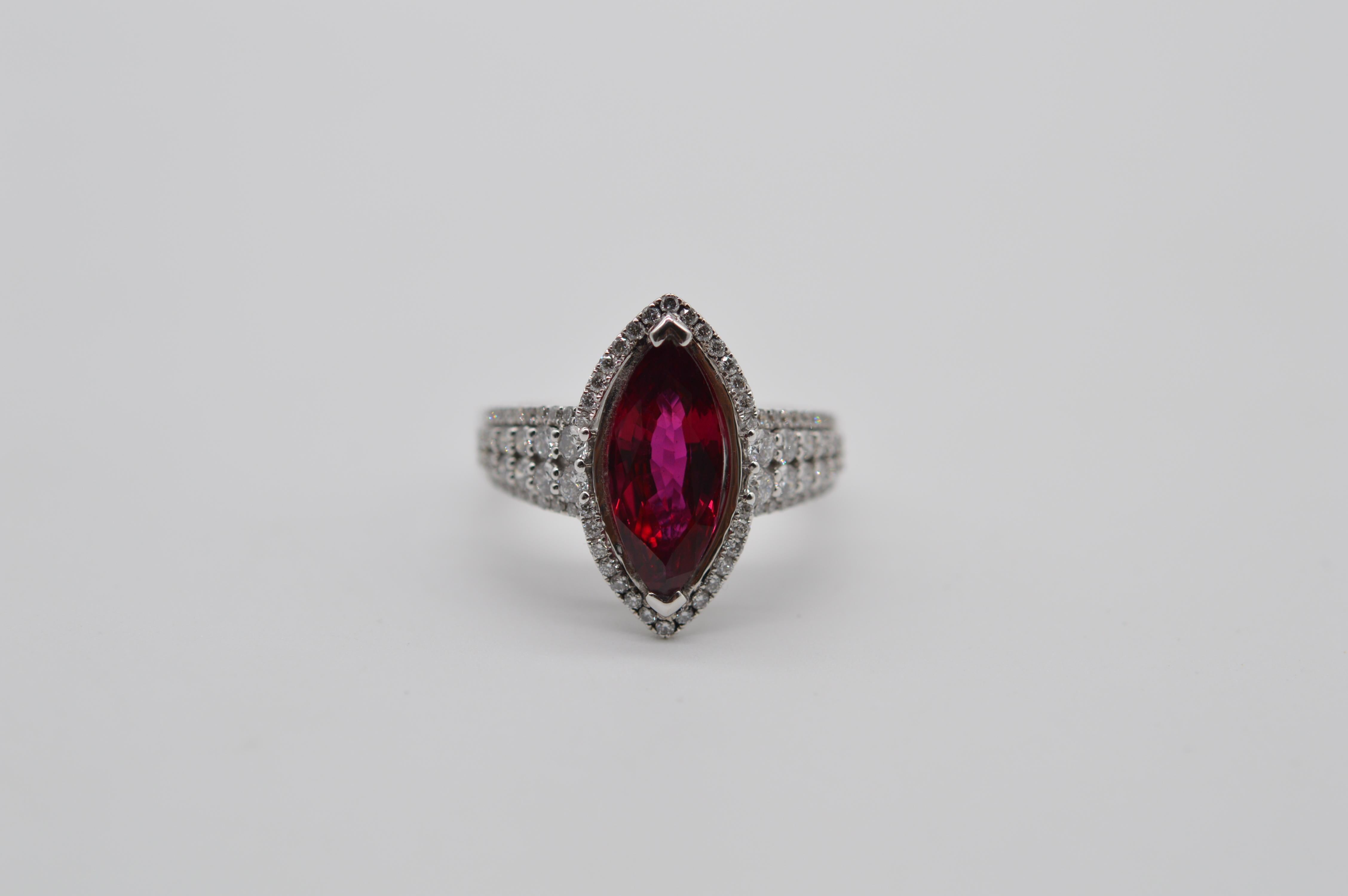 Intense Siam Marquise Ruby 2.95 carats ring unworn
Mounted in an 18K White Gold ring
The ring size is 53
The total weight of the ring is 6.4 grams
Set with 84 Round Diamonds for a total weight of 0.81 carats
This Ruby is accompanied by a gemstone