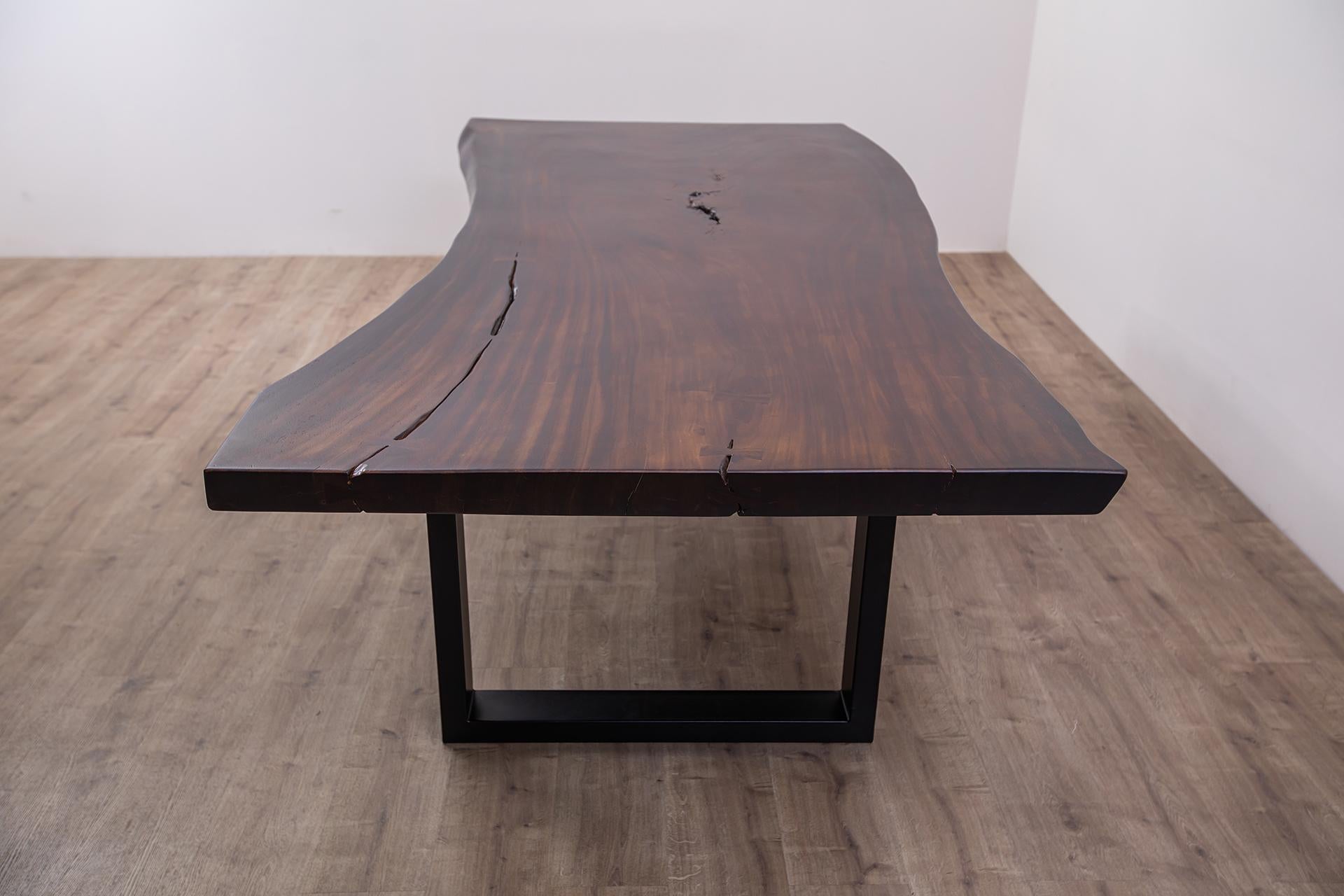 Discover the allure of our one-of-a-kind solid acacia dining/conference table, a true statement piece for your dining area. Handcrafted with care and attention to detail, this table showcases the natural beauty and uniqueness of solid acacia