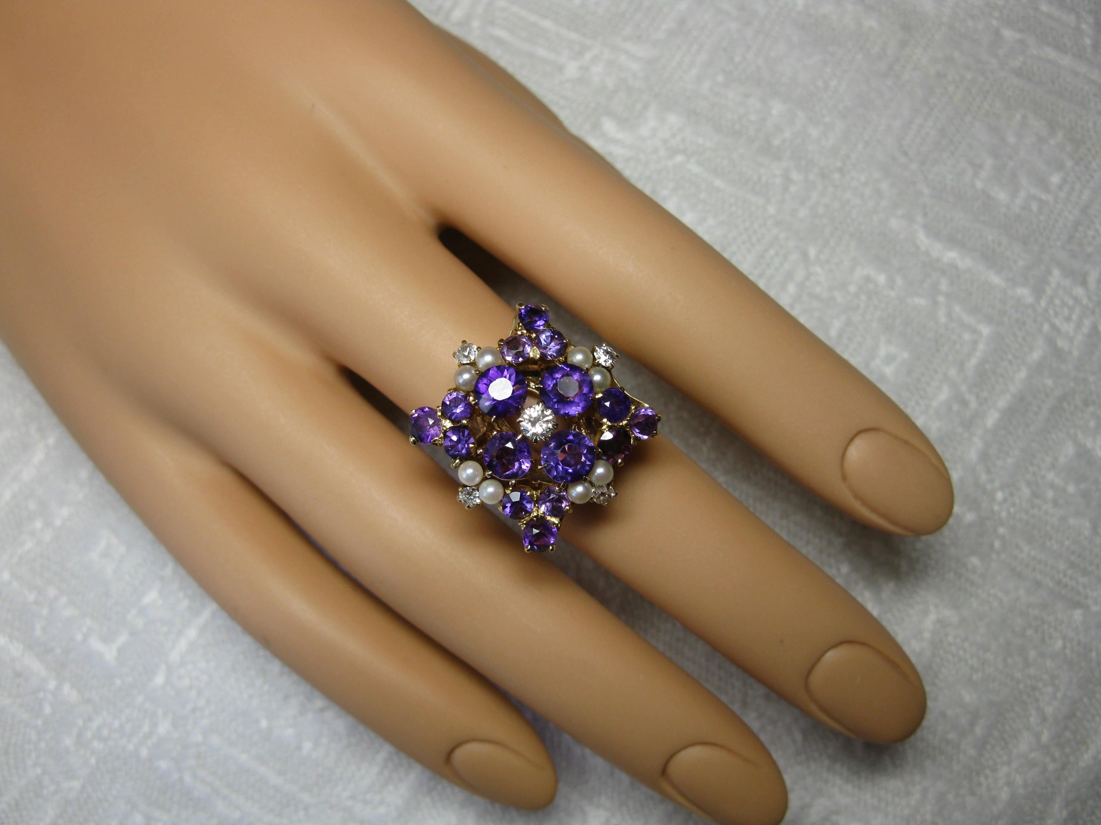 THIS IS A SPECTACULAR RING FROM ONE OF THE MOST PROMINENT ORIGINAL LOS ANGELES FAMILIES.  THE RING IS HIGHLIGHTED BY THE RADIANT ROUND FACETED SIBERIAN AMETHYSTS - THE COLOR OF THESE JEWELS IS EXTRAORDINARY!   THEN THERE ARE THE DIAMONDS - OF THE