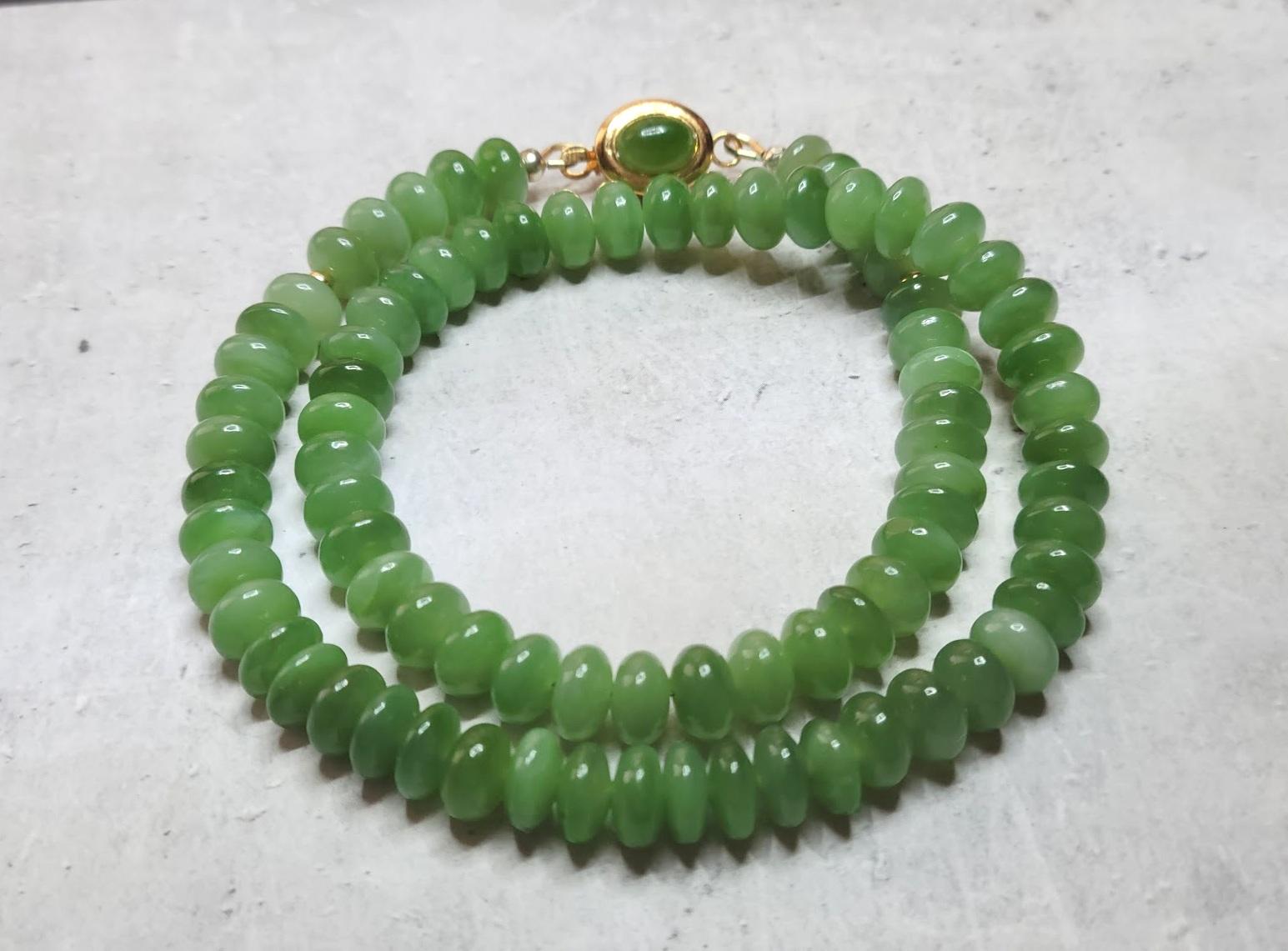 This charming necklace is made of high-quality natural rare Russian Siberian chatoyant nephrite. The nephrite beads are top quality, pure, uniform, soft green, and sumptuous in how they look and feel.
This pure, classic green nephrite contains a