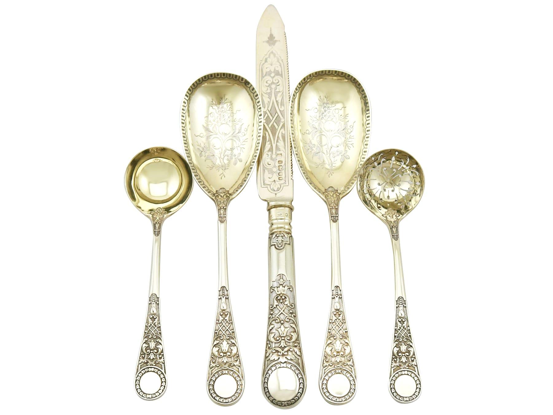 An exceptional, fine and impressive antique Victorian English sterling silver fruit serving set - boxed; an addition to our dining silverware collection.

This exceptional antique Victorian sterling silver fruit serving set consists of a knife, pair