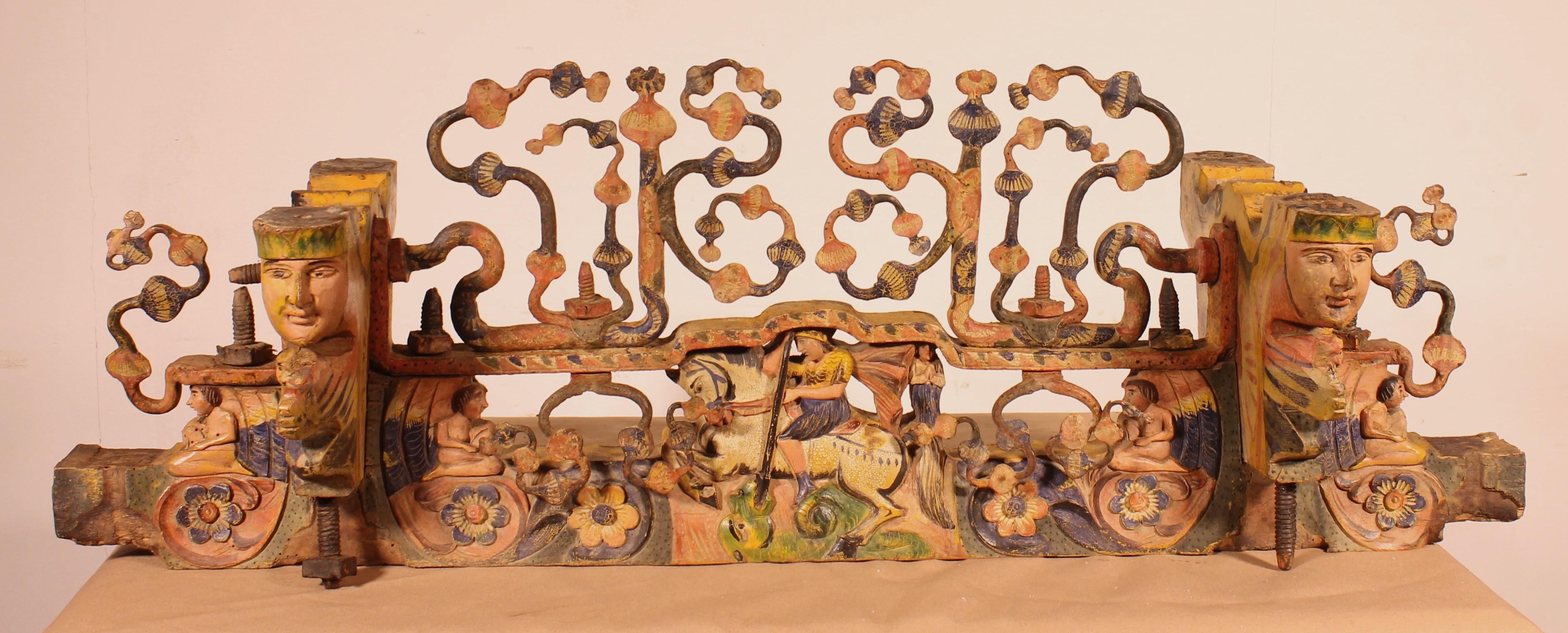Rare Sicilian Cart Axle in Polychrome Wood and Wrought Iron from the 19th Century

Superb carved wood representing Saint George slaying the dragon in its center. We can also find four caryatids
Very beautiful Sicilian work mixing carved wood and