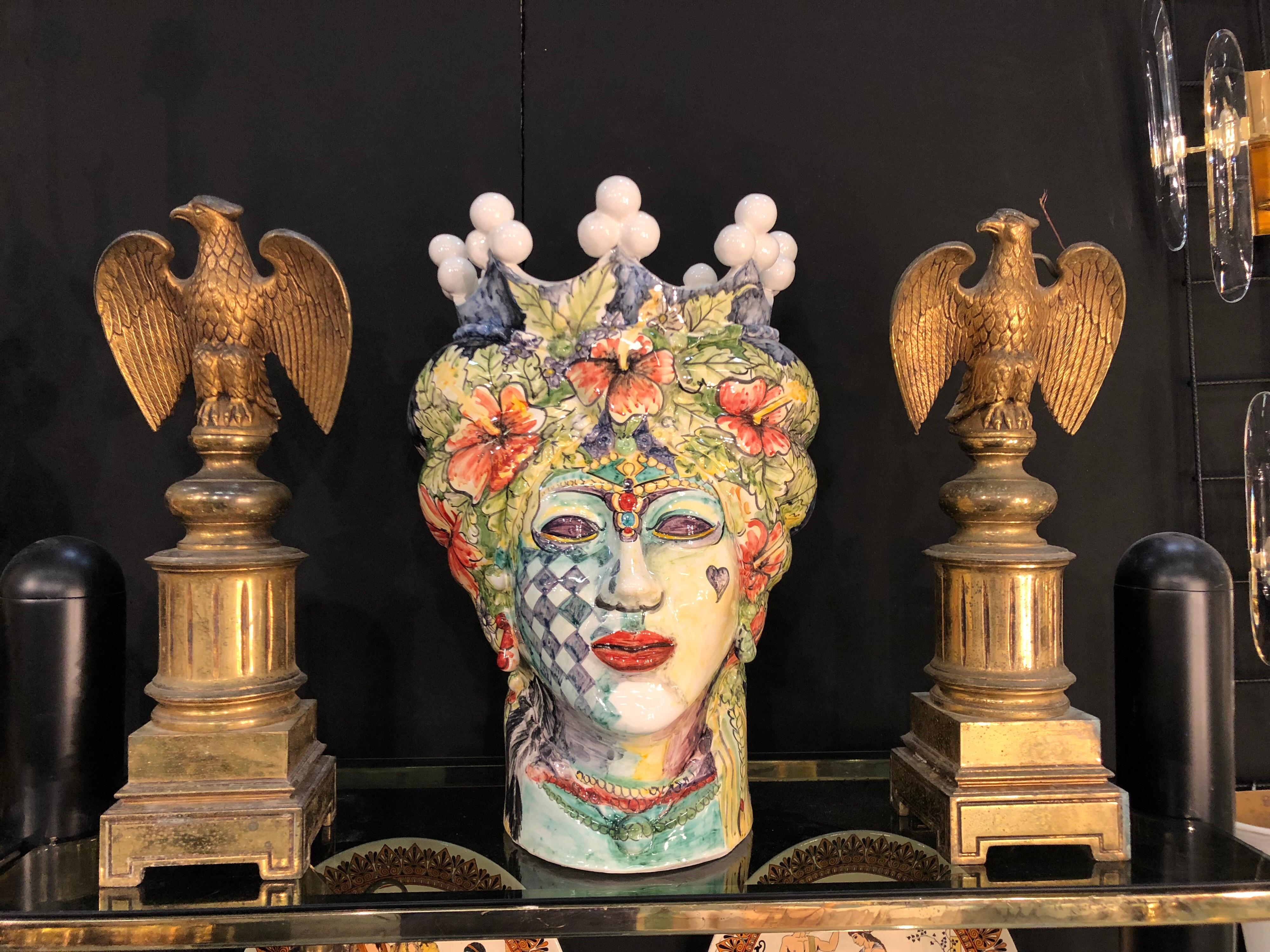 It's an unique piece made by a sicilian young artist, it's in white clay and fully hand-painted, made in Caltagirone, a little town near Catania. Signed 1/1 m.r. on the bottom.