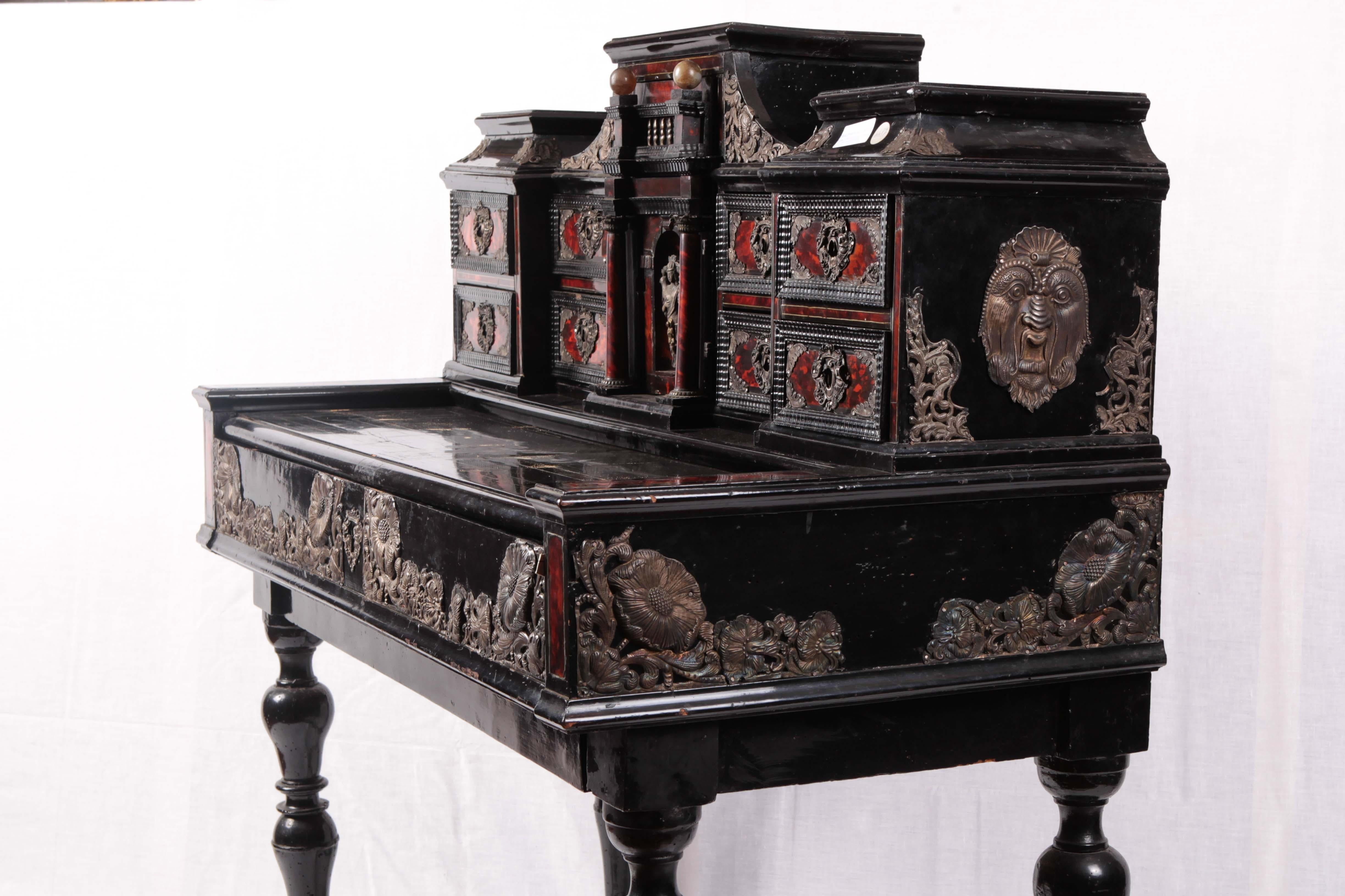 Writing desk in ebony embellished with tortoiseshell inserts and silver finishes. Drawers along with a sliding and folding top.
Origin: Southern Italy, Sicily
Period: mid-1700s
Dimensions: 108 x 54 x 124 cm.
 