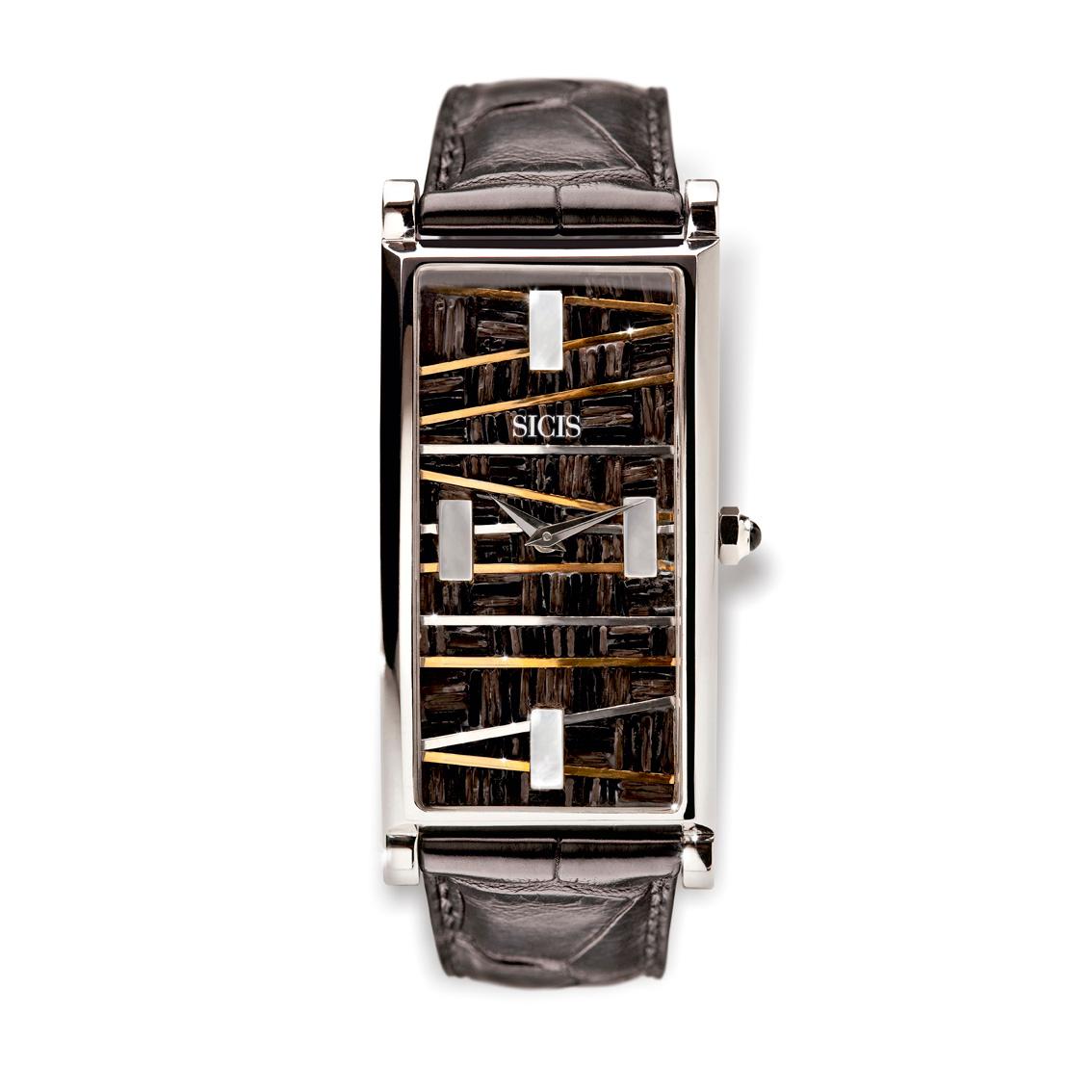 
Designed by the American designer Roger Thomas.

Micromosaic watch in white gold 18 kt and mother of pearl. Alligator strap. Swiss quartz movement. Limited edition of 10 pieces.

- Micromosaic
- White Gold 18 kt 
- Mother of pearl
- Sapphire