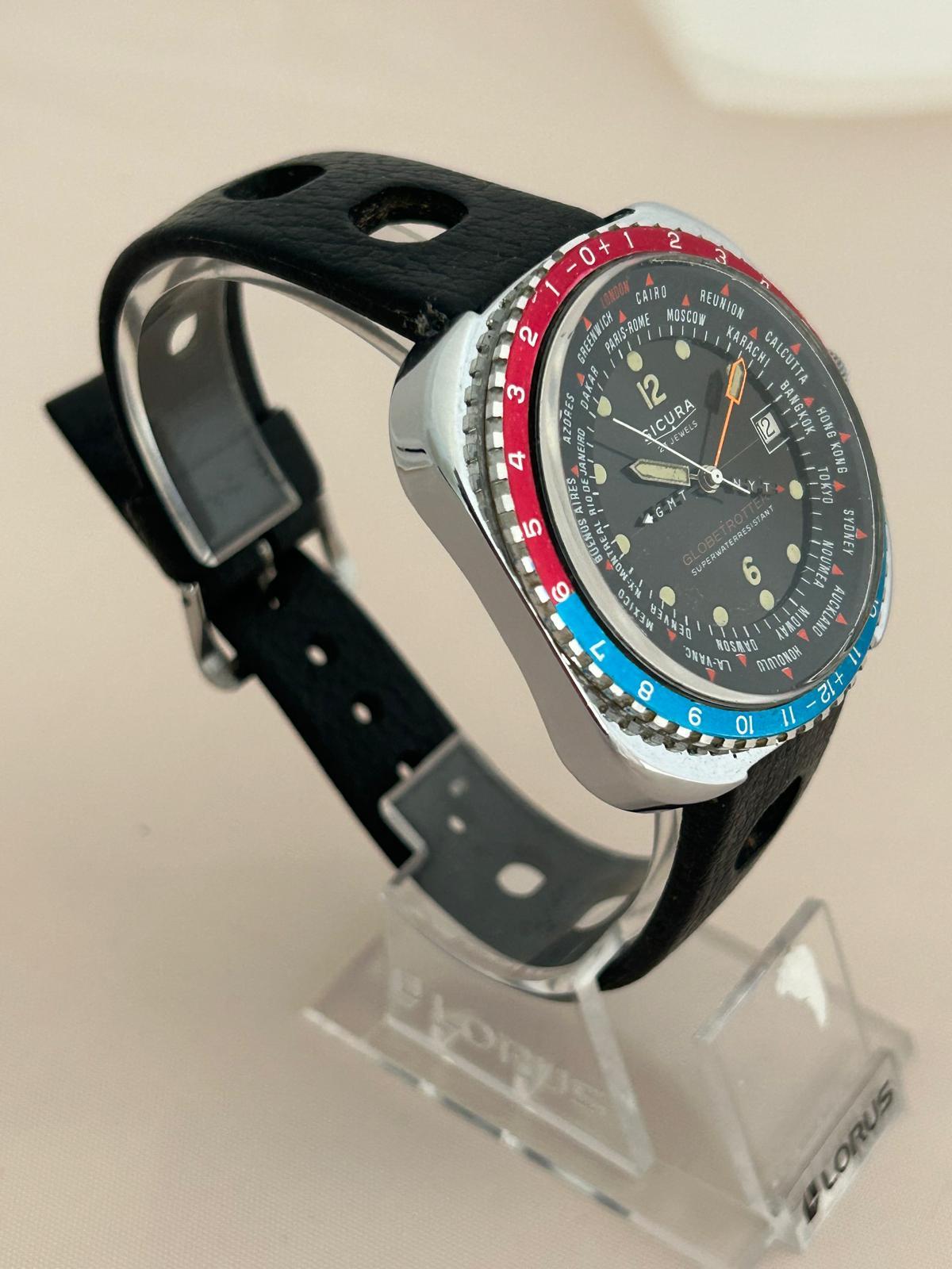 Our vintage Sicura Globetrotter features a 41mm stainless steel case (44mm inc crown) with rotating blue/ red bezel and powered by a 23 jewel manually wound movement. The idea of the Globetrotter GMT was to provide multiple timezones for pilots or
