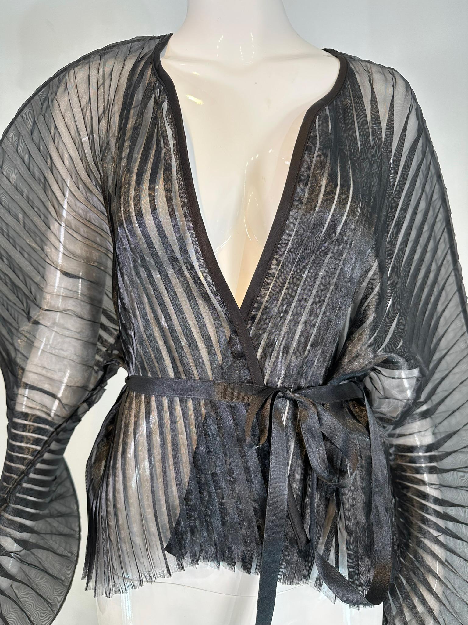 Sid Neigum Spring 2018 RTW signature sculptural sheer pleated wired wrap top unworn with tags. Marked size 0, fits up to a 4.
 Sheer pleated black polyester wrap top has wide sleeves that are cased wired and undulate upon wearing, they are statement