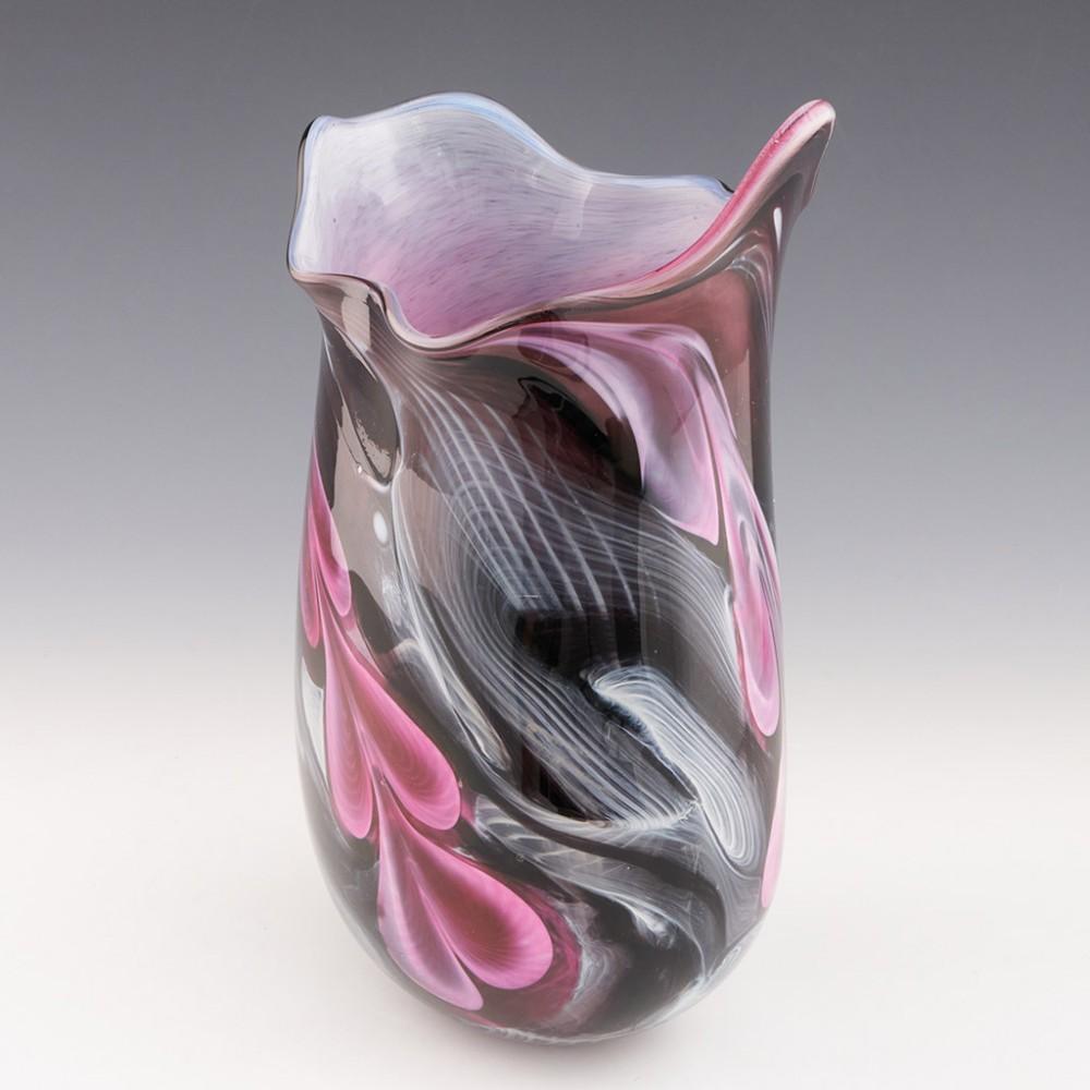 Heading : Siddy Langley Journey vase
Date : 2023
Origin : Devon, England
Bowl Features : Pink, white, amethyst and black swirled glass cased in clear
Marks : Signed Siddy Langley 2023
Type : Lead
Size : 26.5cm height, 16.6cm max width
Condition :
