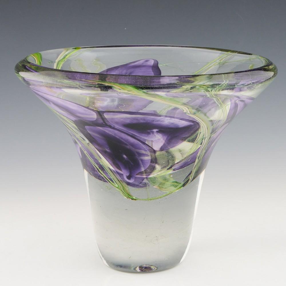 Heading : Siddy Langley Tradescantia vase
Date : 2012
Origin : Devon, England
Bowl Features : Lilac and green glass depicting Tradescantia (spiderwort) cased in clear
Marks : Signed Siddy Langley 2012
Type :  Lead
Size : 18.3cm height, 22.5cm