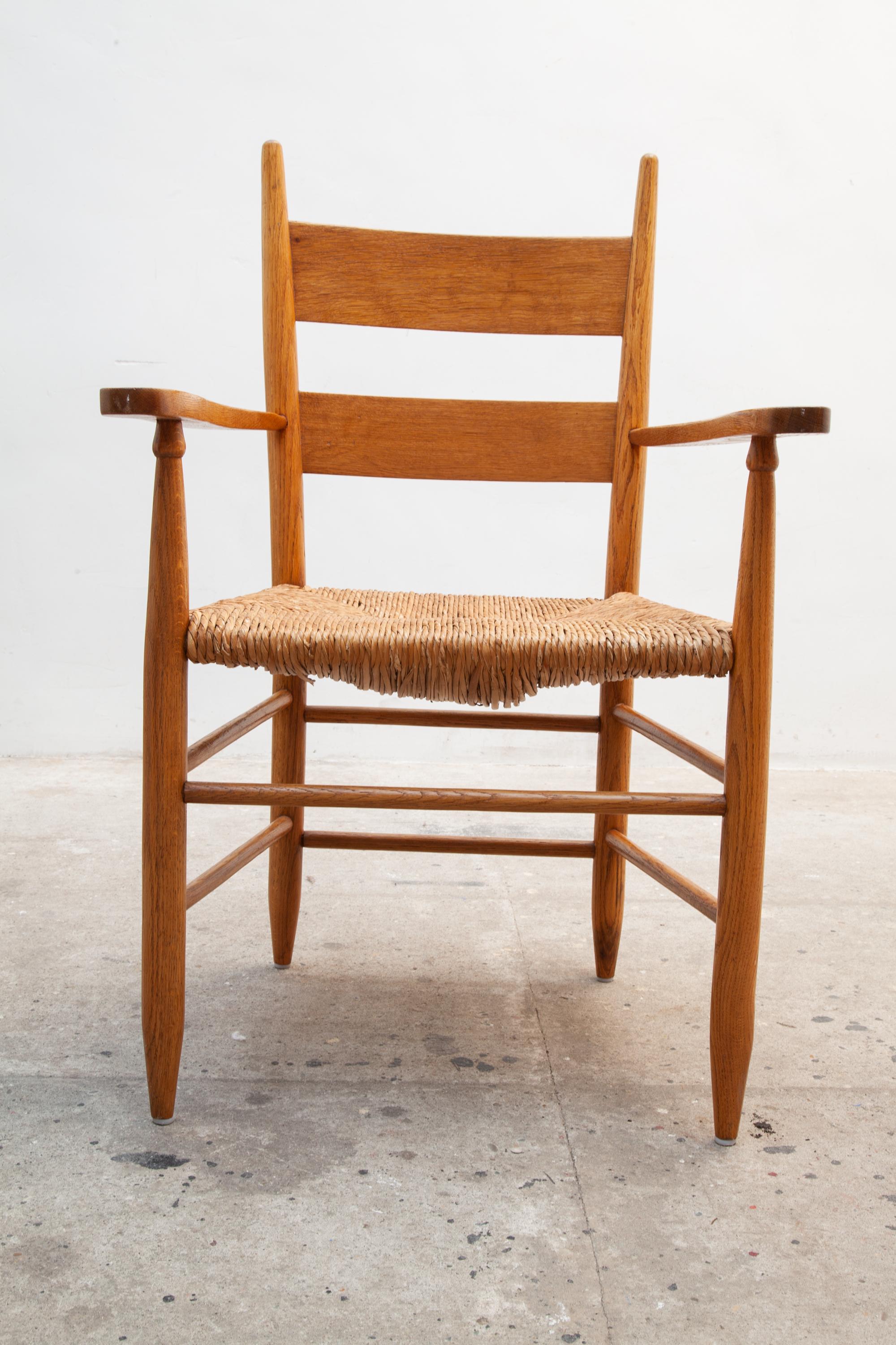 Swedish Vintage mid-century armchair. Features a wooden frame with beautifully shaped armrests. Detailed design of pleasant curves and raffia woven seat.
Dimensions:62W x 95H x 55D cm
