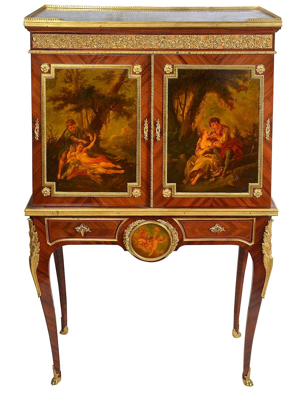A fine quality late 19th Century French Kingwood, ormolu mounted side cabinet on stand, having the original marble top with a three quarter pierced brass gallery. A pair of wonderfully hand painted Verni Martin doors, depicting lovers. these open to