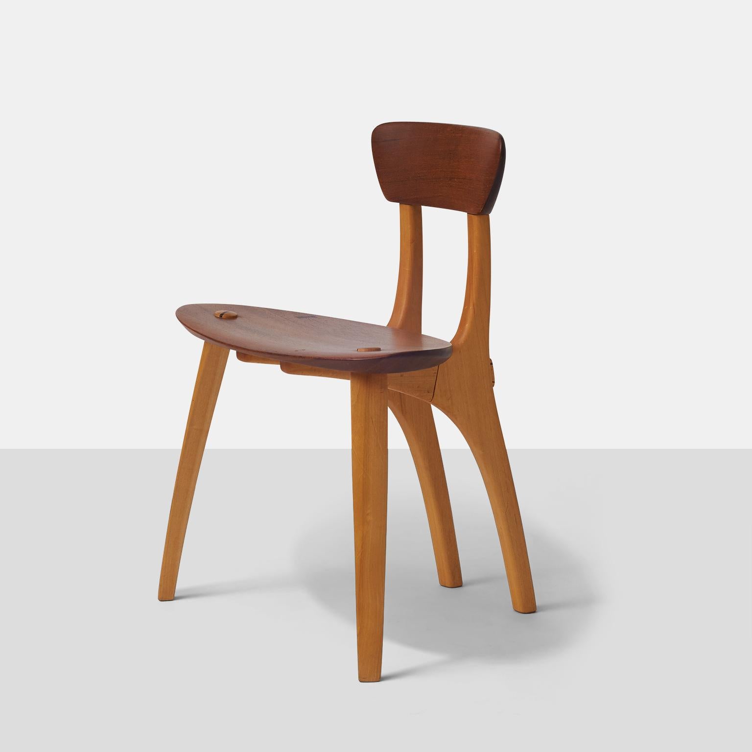 A unique side chair of two different Brazilian hardwoods, by Morito. The curved back and angle of the seat make this a very comfortable chair.