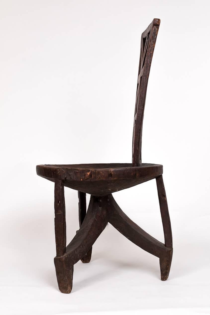 A very good hand-carved Ethiopian side chair, with good age and very nice surface patina. These chairs are hard to find these days.