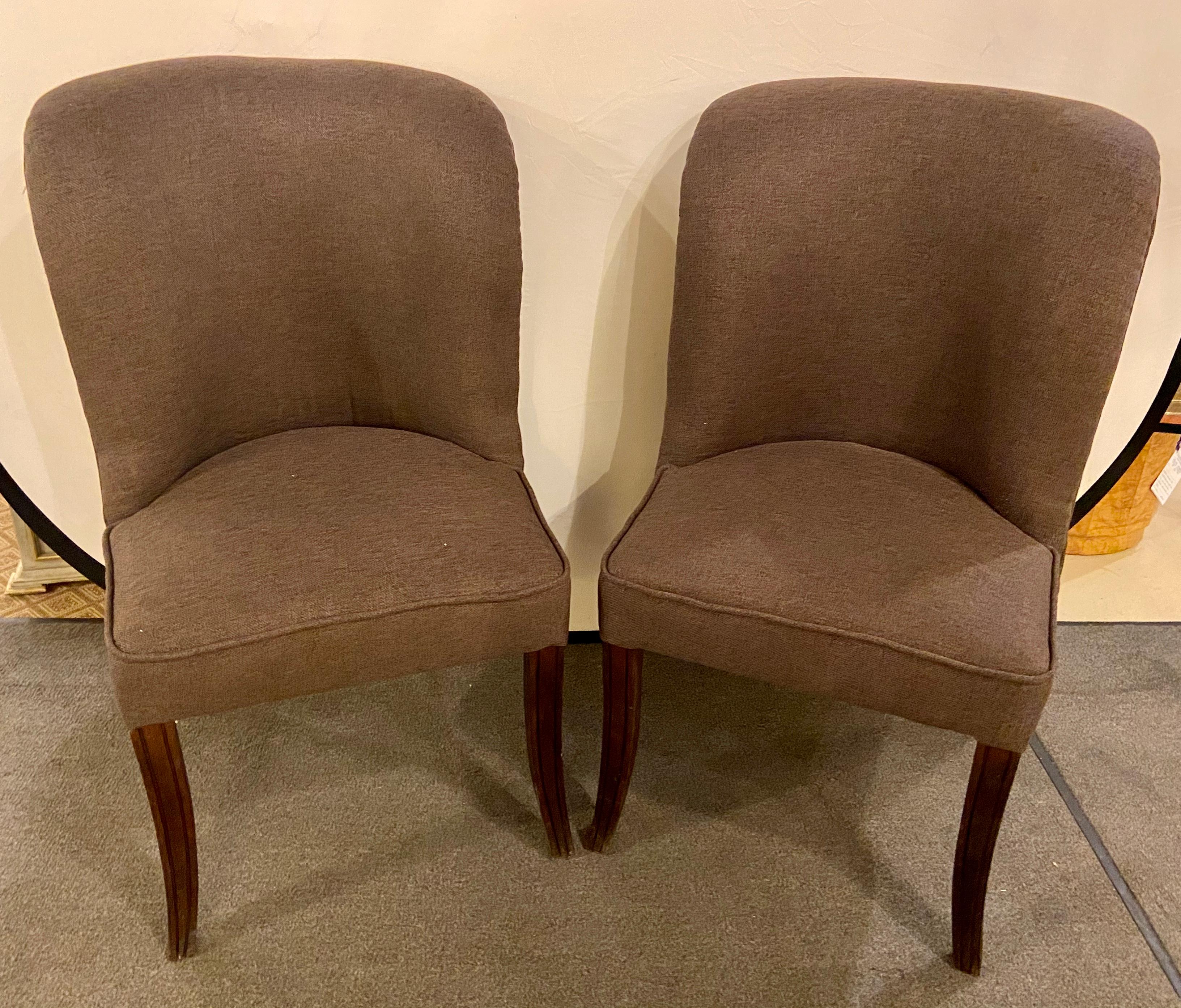Karl Springer Style MCM side Gray Chairs, a Pair
chic and very comfortable, the pair of Mid-Century Modern style chairs feature a fine new upholstery in gray. The legs are made of wood and hand carved.

Dimensions: H 38 in. x W 23 in. x D 23 in. x
