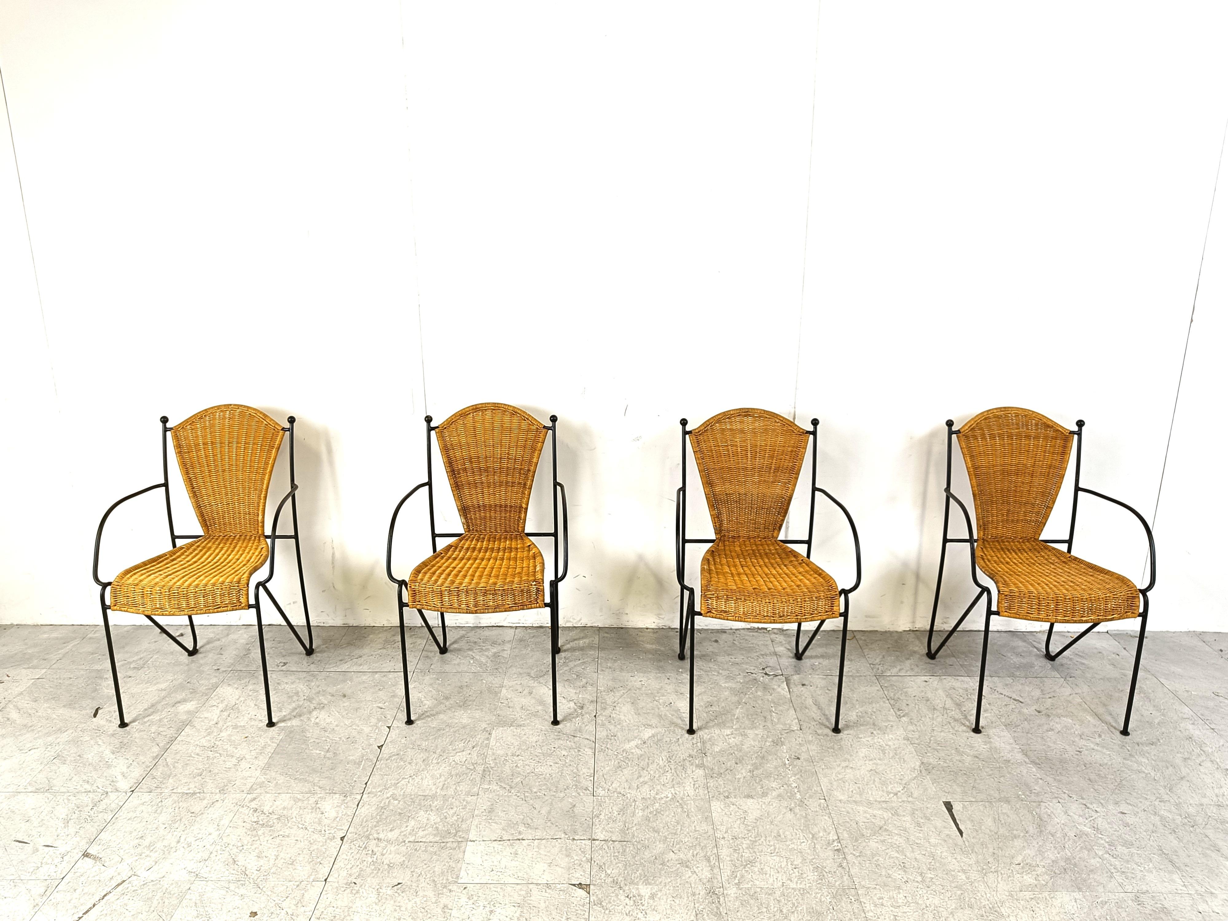Vintage wrought iron and wicker bistro/dining chairs designed by Frederick Weinberg.

Elegant black wrought frame with a curvy wicker seat.

Very sturdy chairs good for in home and outside use.

1960s - France

Very good