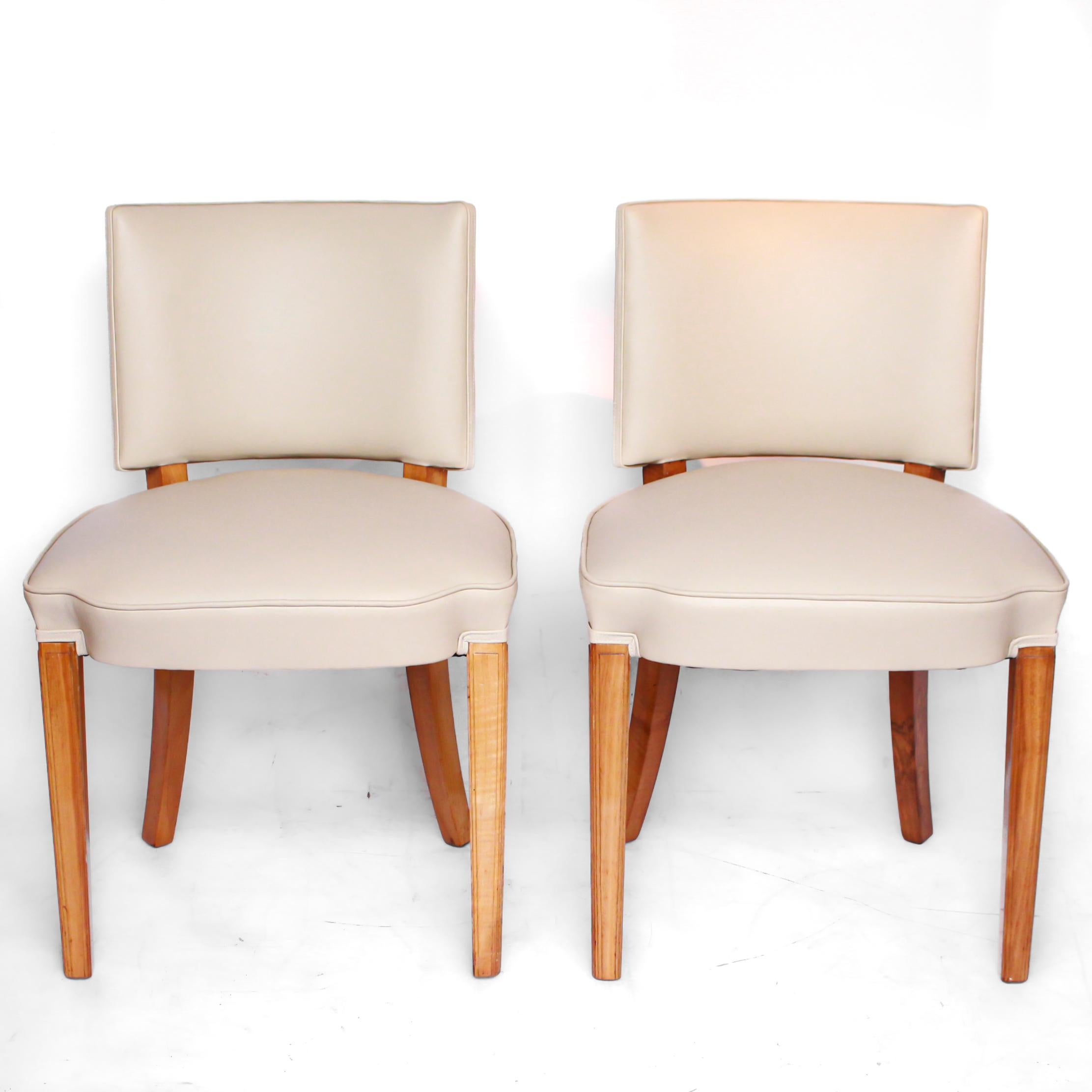 A pair of Art Deco side chairs. Solid and veneered walnut. Upholstered in cream leather. 

Dimensions: H 78 cm, W 51 cm, seat D 45 cm

Origin: English

Date: circa 1935

Item no: 1712195.