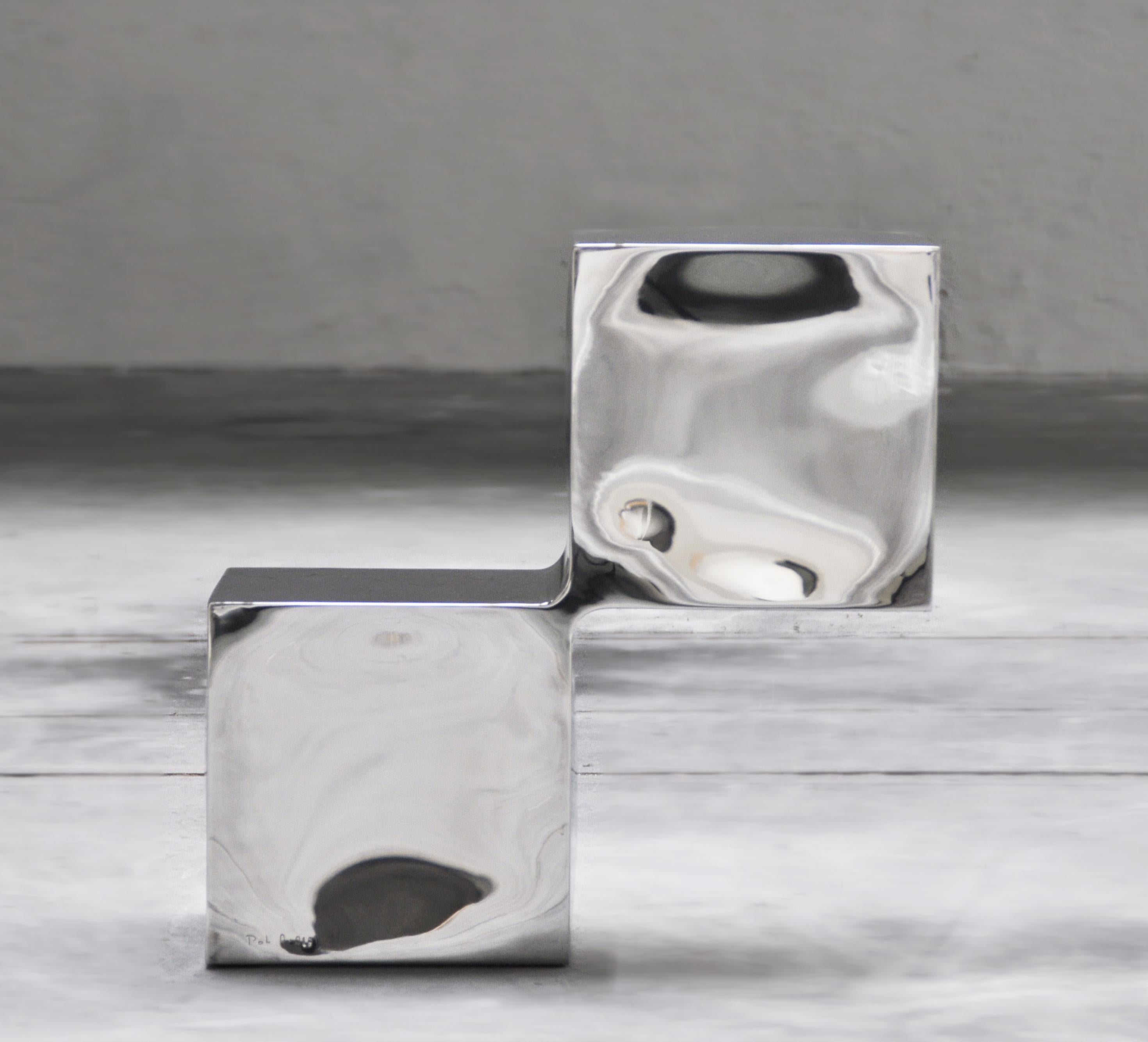 Side Cubes by Pol Quadens 
Limited Edition Of 24+4 Pieces.
Dimensions: D 30 x W 60 x H 60 cm.
Materials: Polished stainless steel.

Pol Quadens was born in Brussels. His father was active in the fields of composites the metal industry, and the world