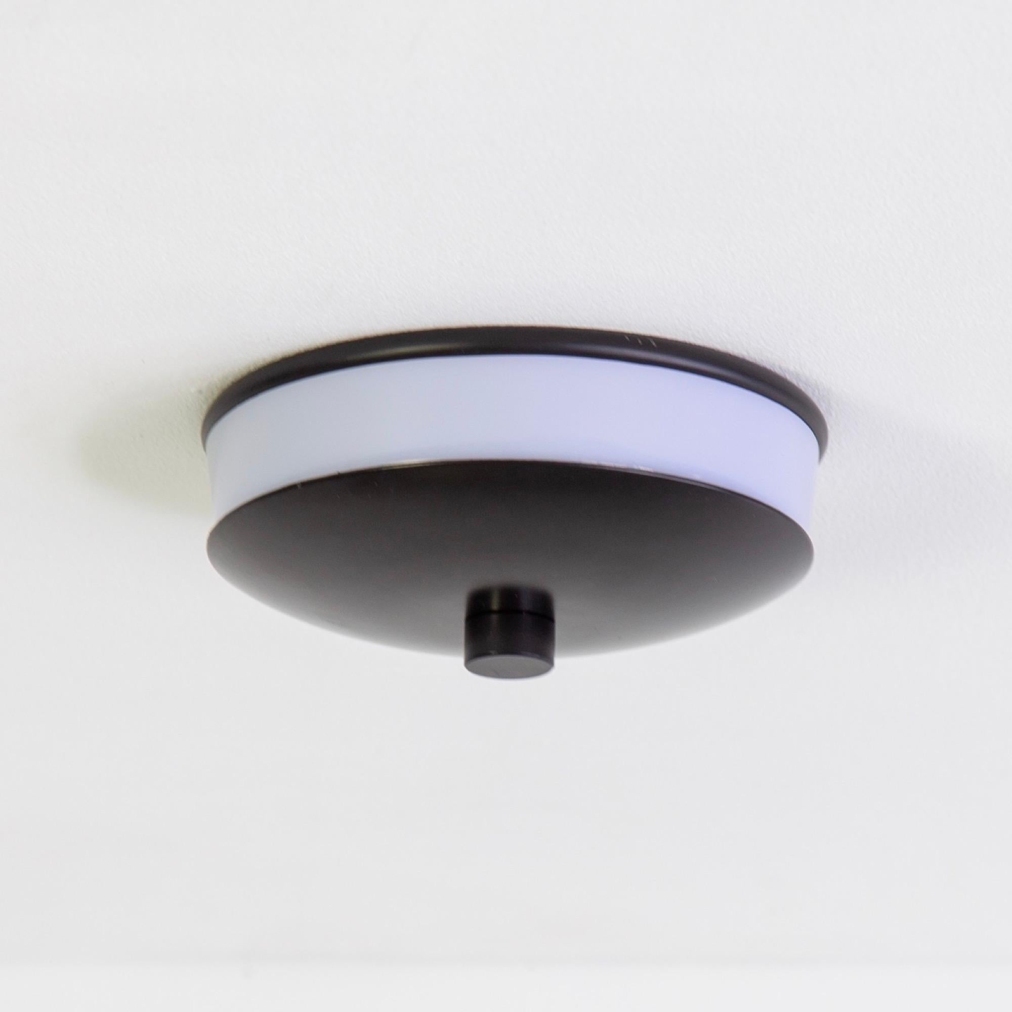 This listing is for 1x Side Flush Mount in black manufactured by Research.Lighting. It can be used as a sconce or flush mount.

Materials: Steel, Acrylic
Finish: Black
Electronics: 2x G8 Sockets, 2x 6 Watt LED Bulbs (included), 600 Lumens per