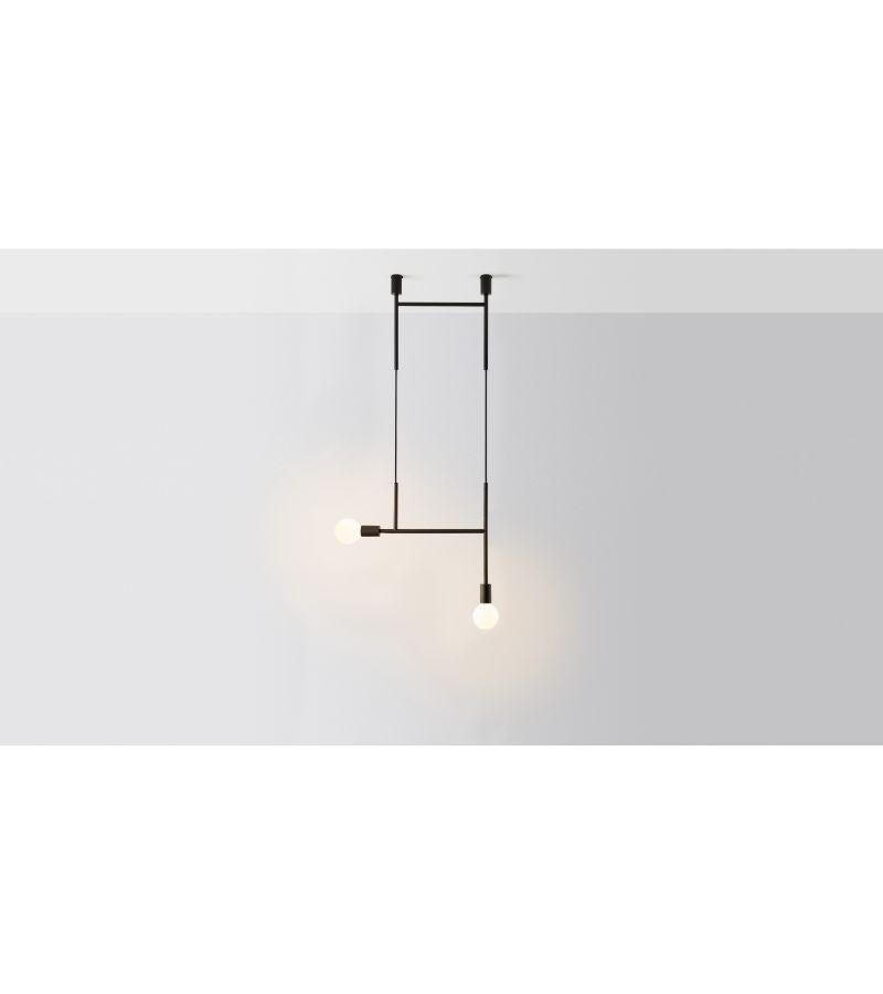 Side kick pendant light by Volker Haug
Dimensions: D 2 x W 63.2 x H 108 cm 
Material: Brass. 
Finish: Polished, Aged, Brushed, Bronzed, Blackened, or Plated
Cord: Fabric or metal
Light: Opal G95 LED (E26/E27 110 - 240V, 12V version